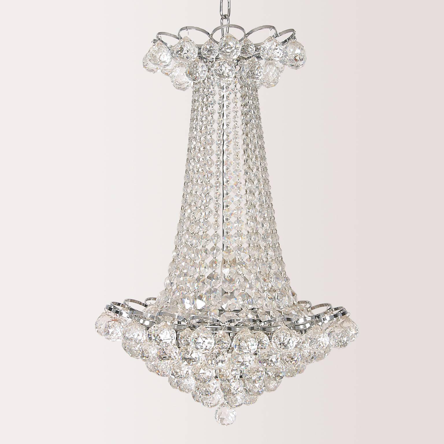 Brilliant cut lead crystal pendant chandelier with six candelabra lights. Cut crystal balls at the top and six-tiered at the bottom with graduating crystal beads cascading from top to bottom ending with the sixth tier of one cut crystal ball.