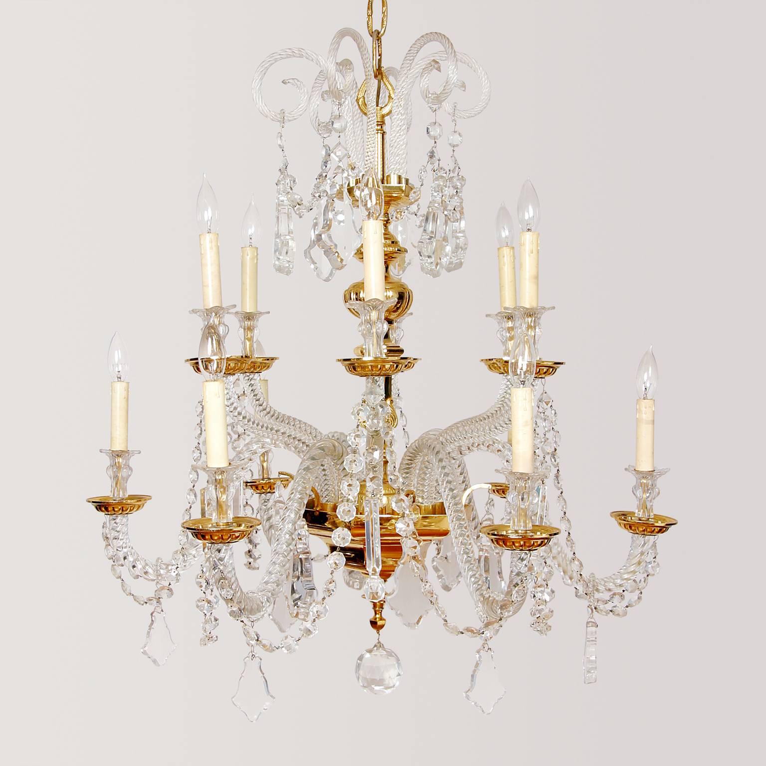 Nine-light, Italian, gold plated over brass and lead crystal, two-tier chandelier. New wiring that meets US Code for installation. Heavy rope twisted crystal arms with all metal fittings gold plated over brass. French cut prisms and beading draping