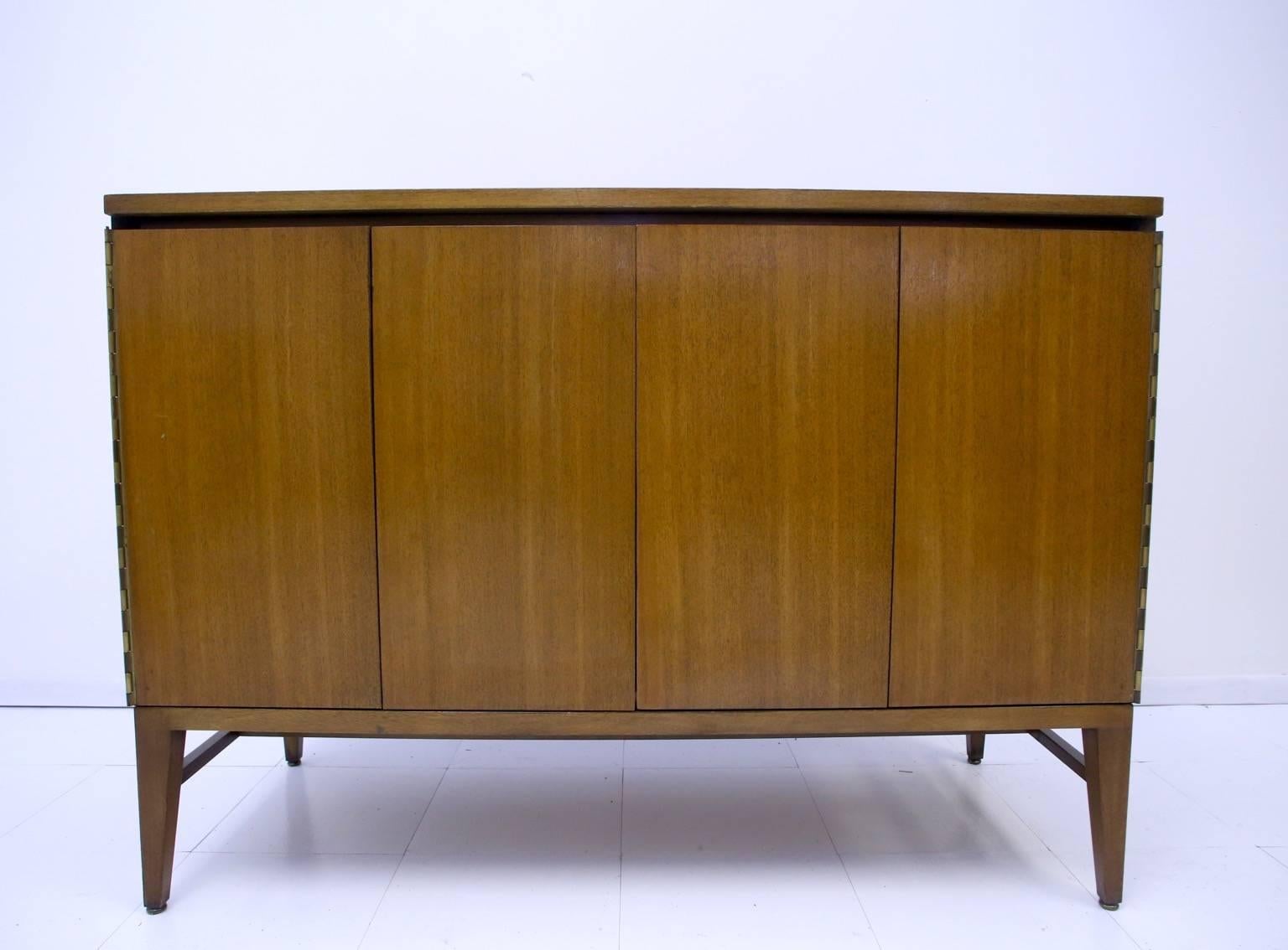 Paul McCobb for Calvin sideboard credenzas. Two available. Price is each. One credenza opens to reveal four drawers and a small shelving area. The other opens for shelving.