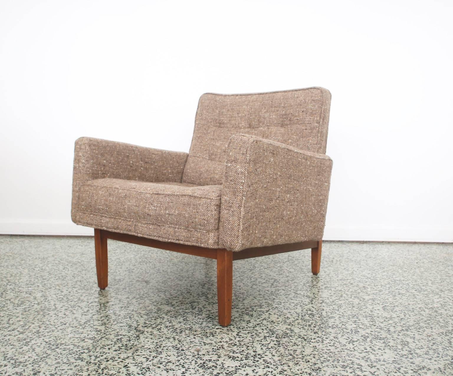 Very hard to find early pair of Florence Knoll long chairs. Chair model 51T. Original fabric. Solid walnut frames in very nice shape. Great opportunity to own a set of rarely seen armchairs.