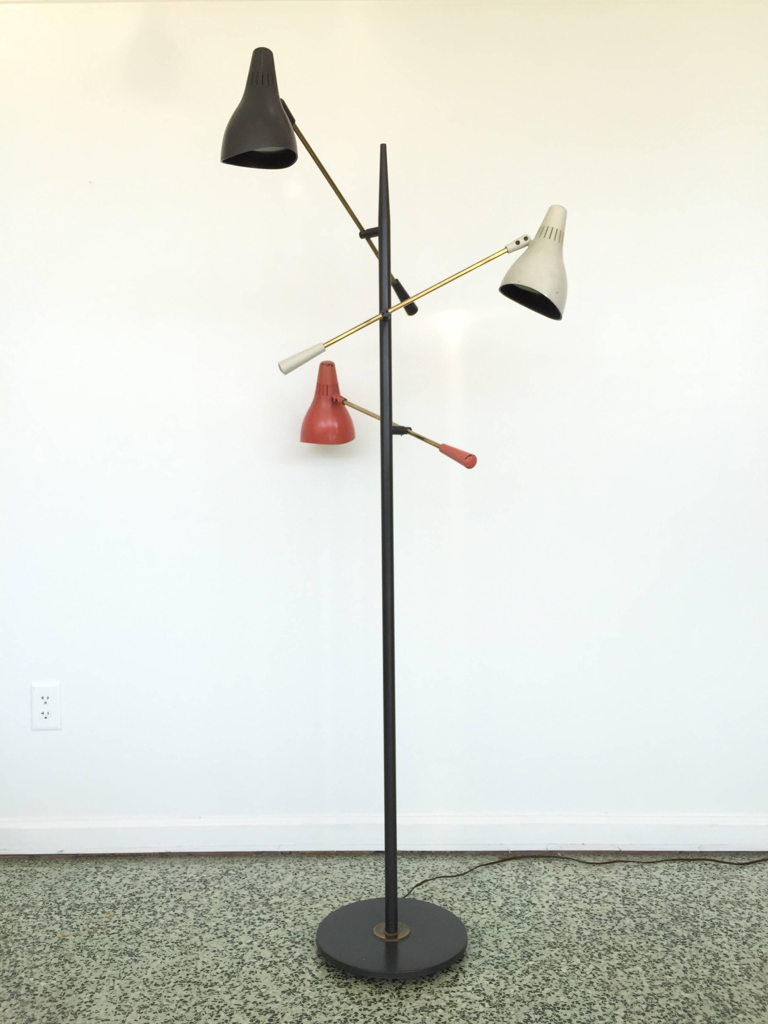 Rare mid-century floor lamp designed for Lightolier with adjustable arms, shades with enamel center post.