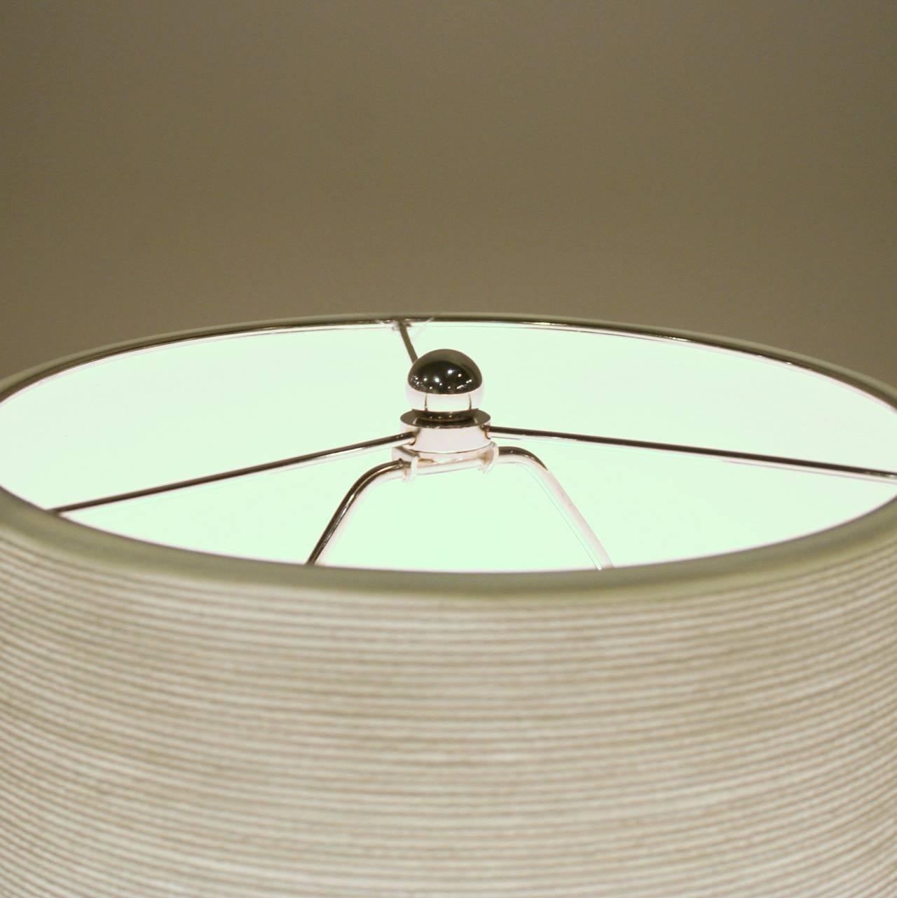 These iconic stoneware Danish lamps were originally designed and produced in the early 1960s by Lotte & Gunnar Bostlund. These timeless pieces are now re-issued and produced in a variety of glazes and shapes, with filament wound fiberglass shades.