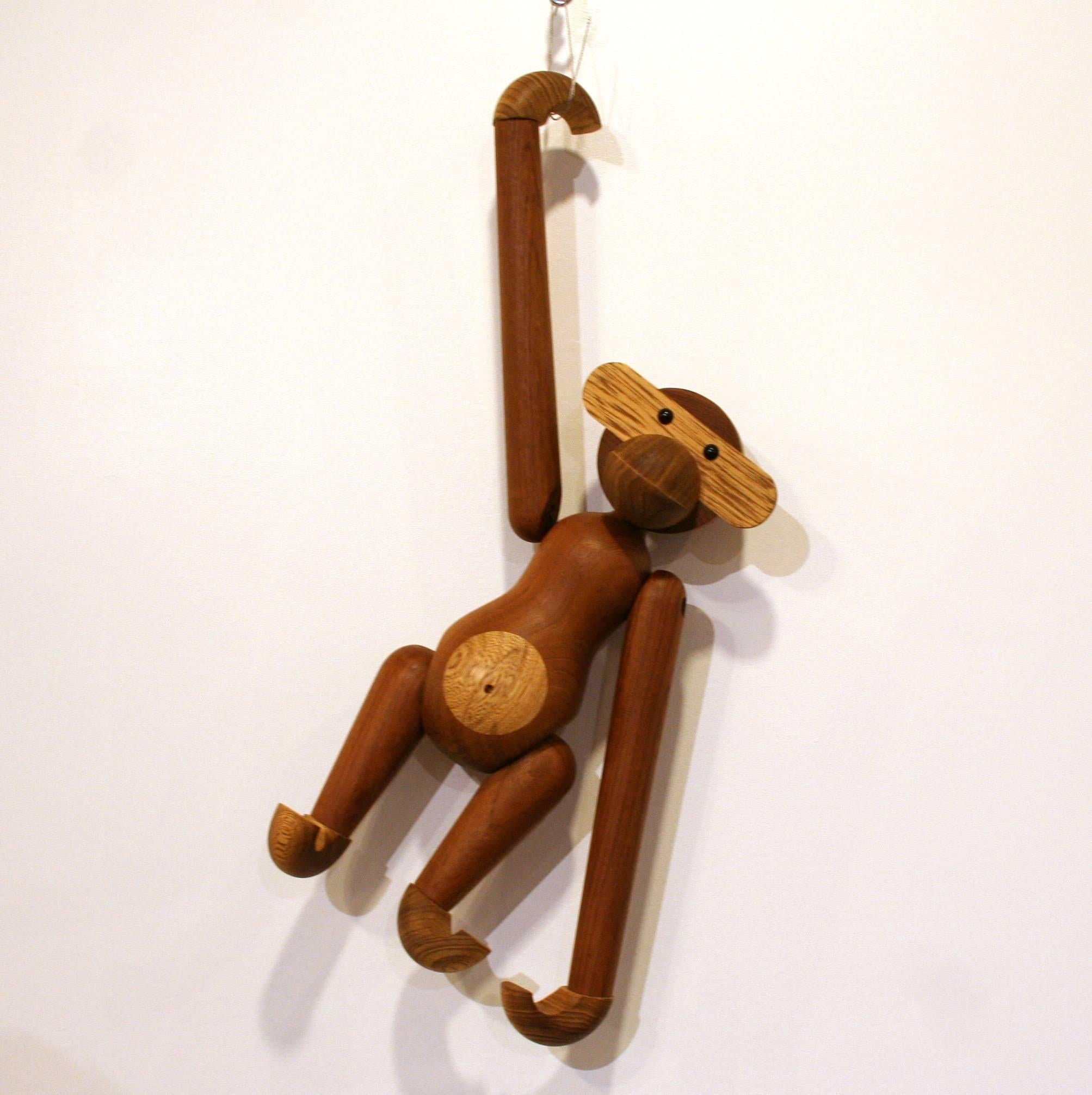 A reproduction of the famous Kay Bojesen toy monkey, originally designed in Denmark in the 1930s. This one is crafted from reclaimed teak and limba wood and is a playful, sculptural element to any space.
 