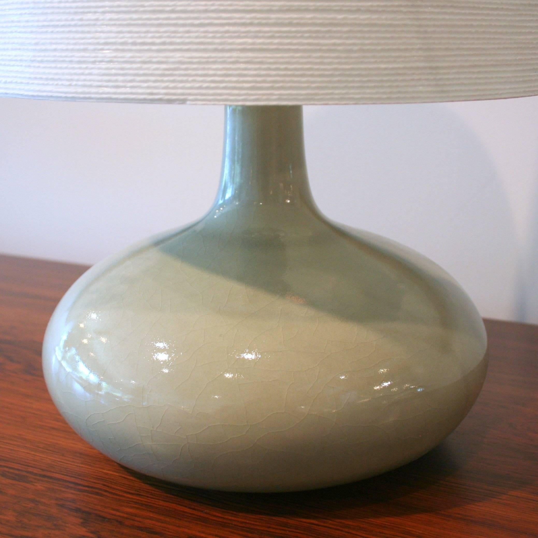 These iconic stoneware Danish lamps were originally designed and produced in the early 1960s by Lotte & Gunnar Bostlund. These timeless pieces are now re-issued and produced in a variety of glazes and shapes, with filament wound fiberglass shades.