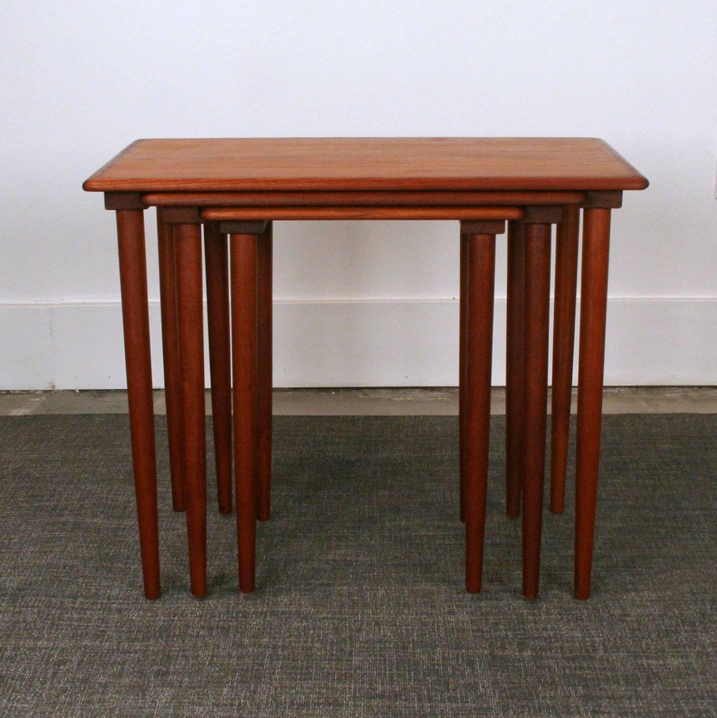 Beautifully crafted vintage teak nesting tables. Made in Denmark.