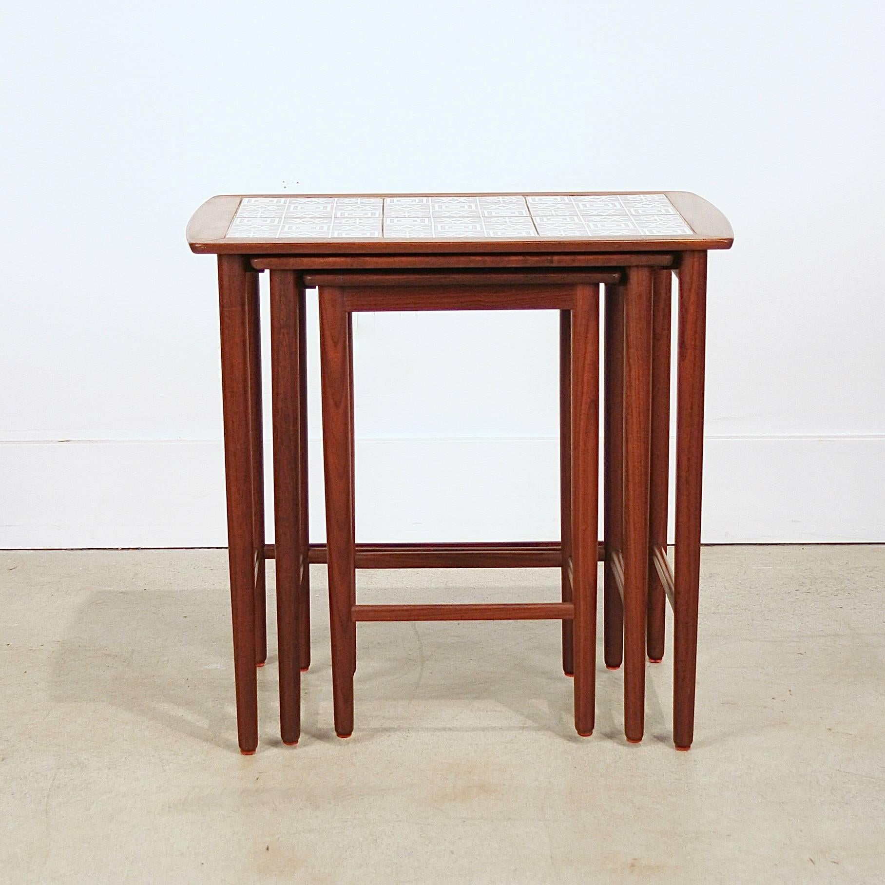 Beautiful vintage Danish walnut and grey tile nesting tables. Made in Denmark.
 