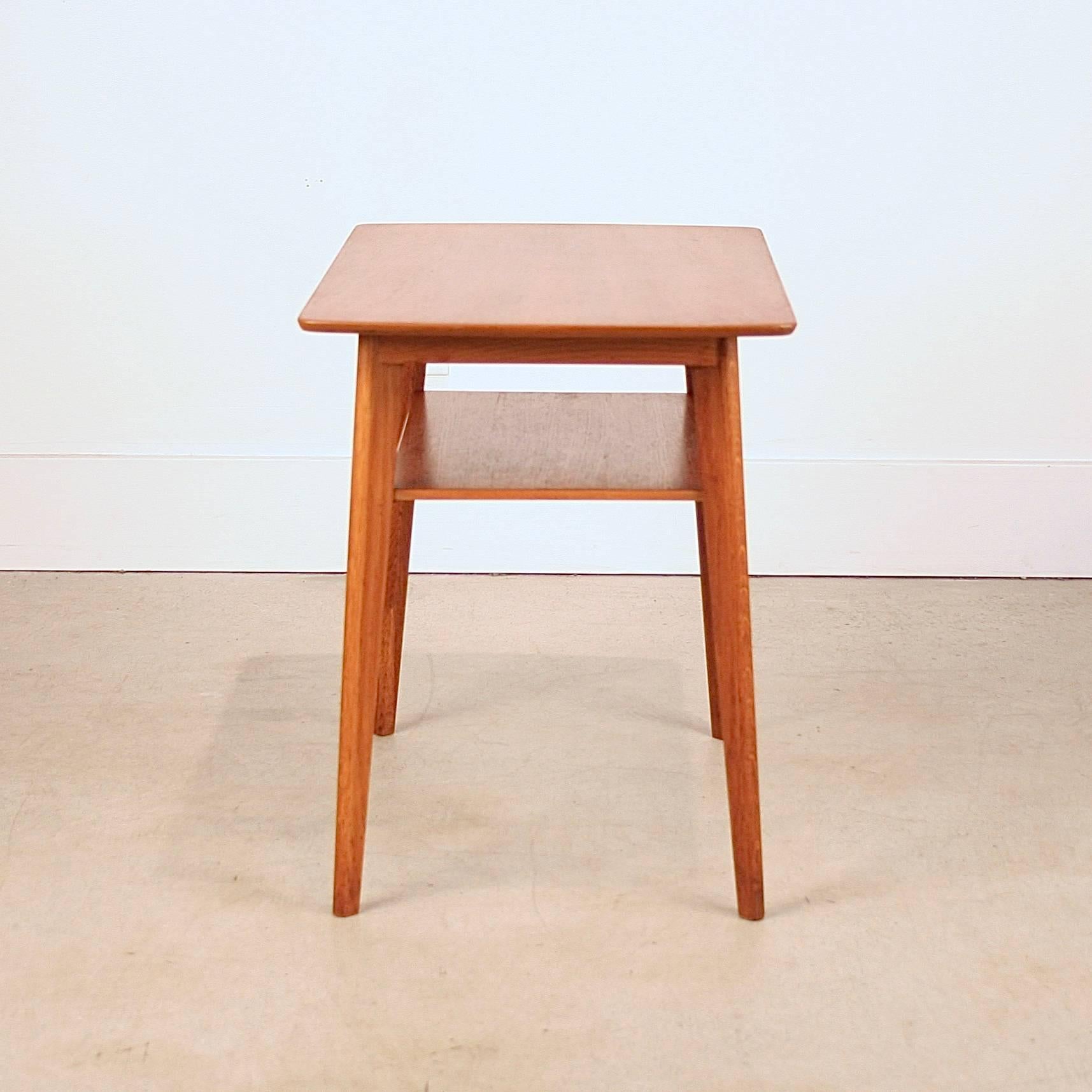 Wonderful small Danish teak side table with shelf. Made in Denmark.
        