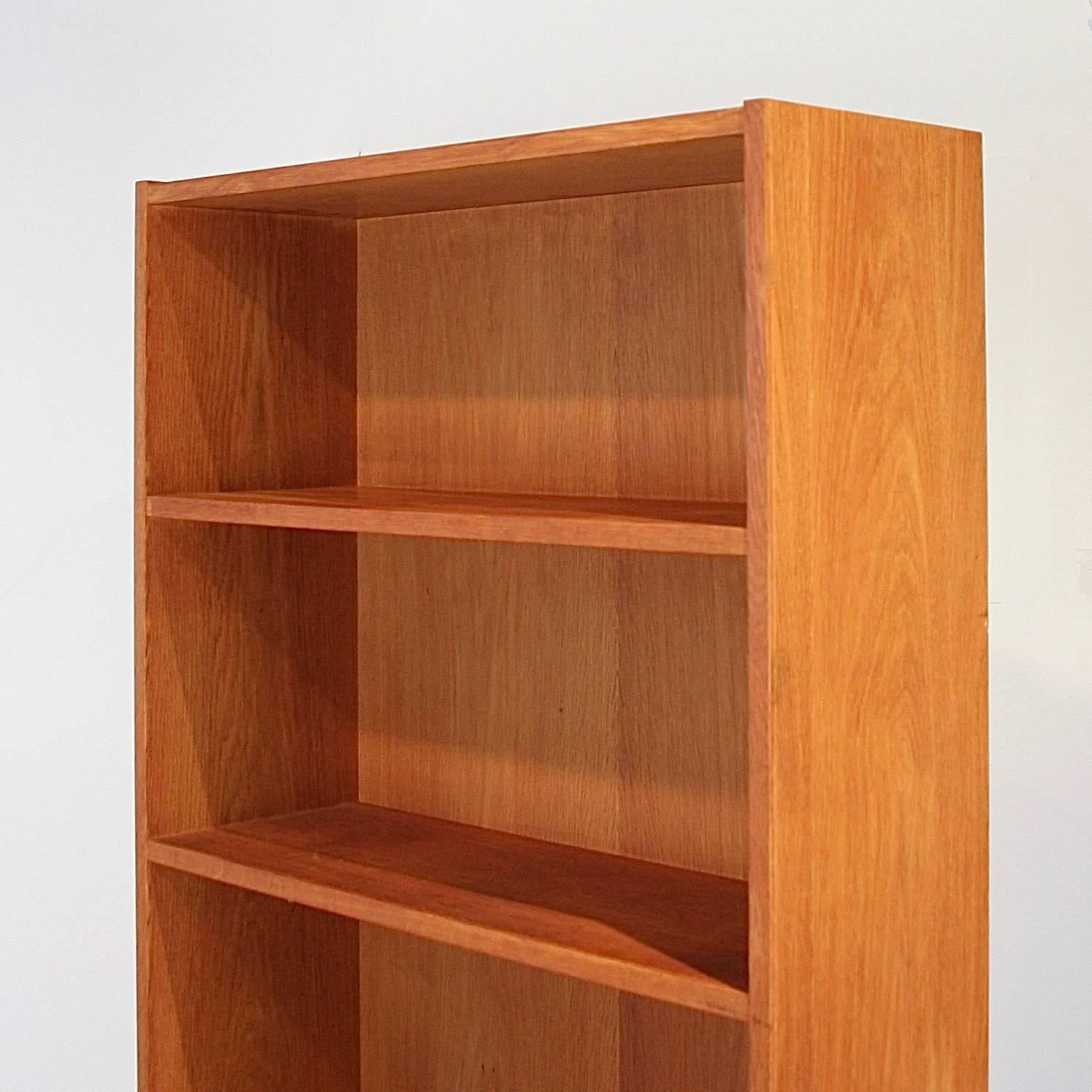 Vintage Danish oak bookcase with fixed shelves.  Made in Denmark.
 