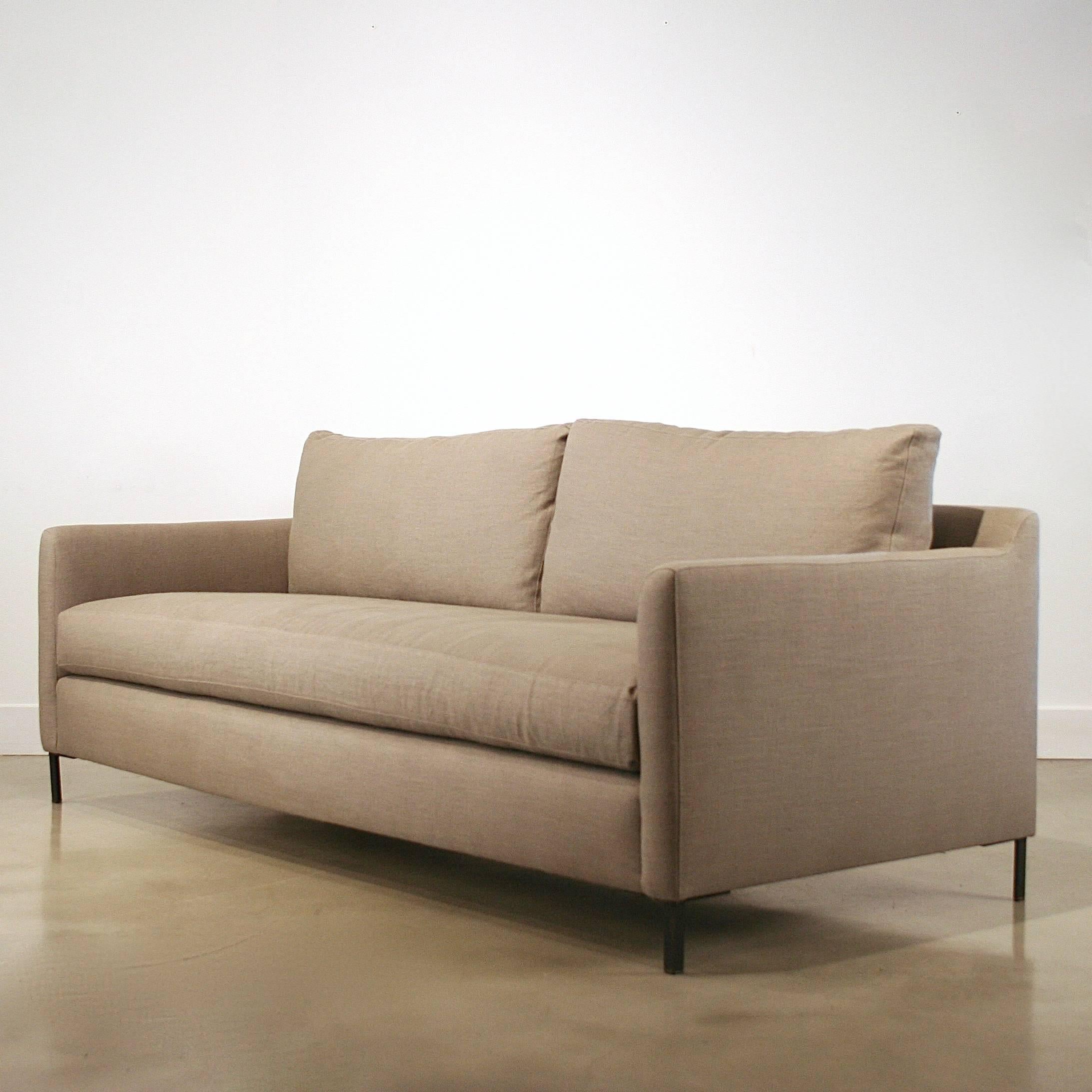 Sleek modern design by Cisco Brothers. Well tailored lines with a soft back are contrasted by the perfect loose cushions on the back and seat. Unparalled comfort, design and bench-made construction. Renowned for superior quality and natural,