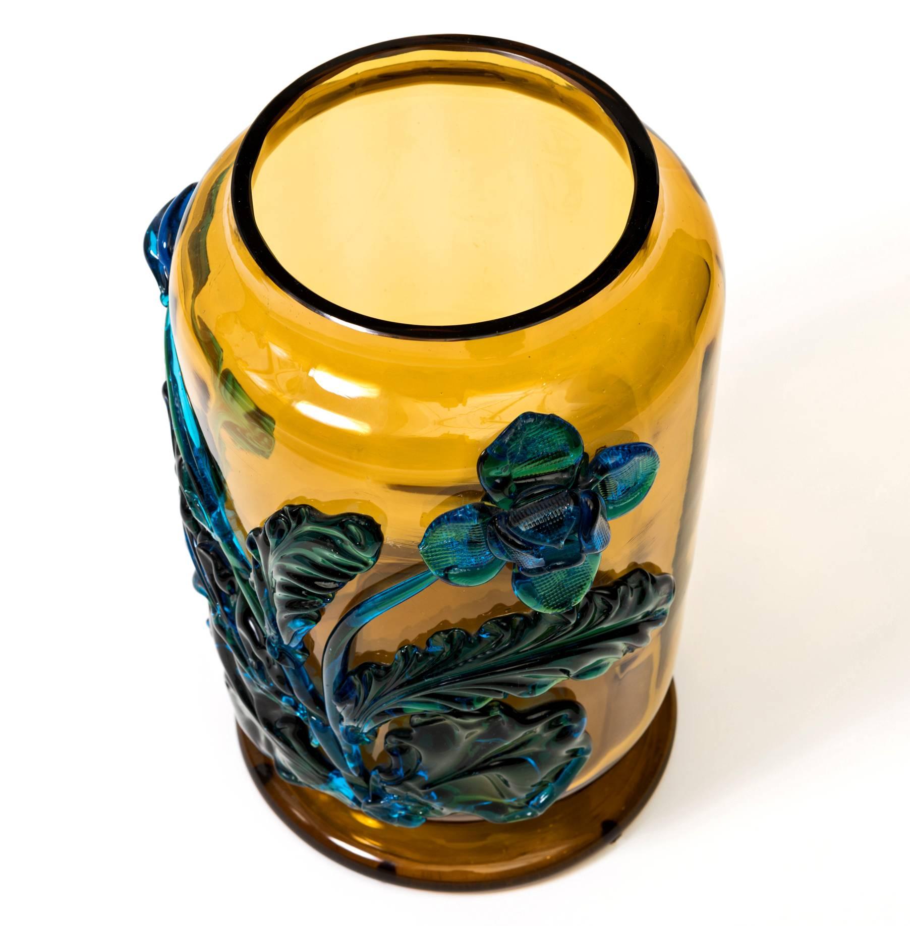 Stunning Art Nouveau art glass vase with applied flowers by Moser. Bold Amber gold with turquoise flowers create this one of a kind piece. Signed.