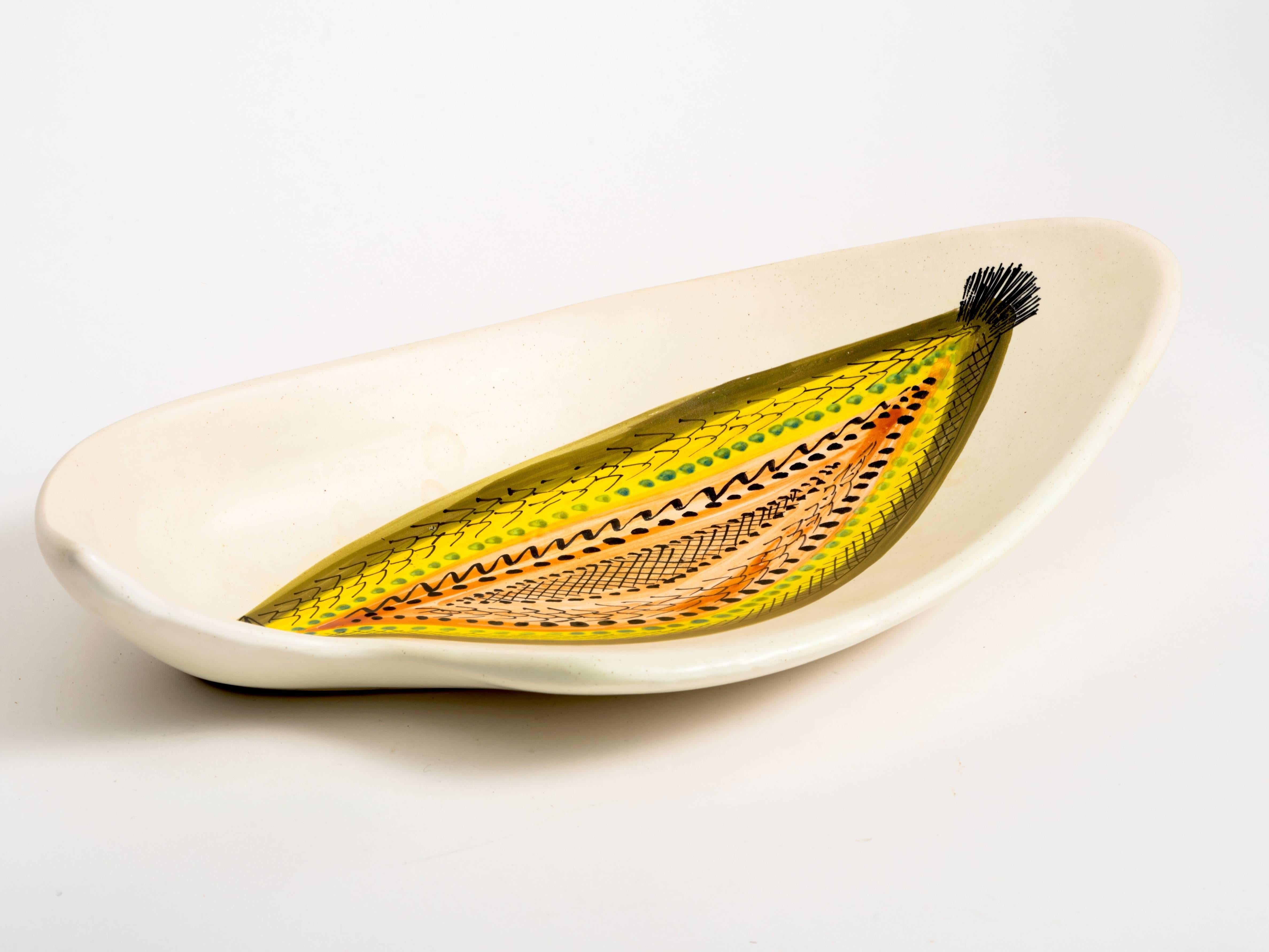 Fabulous hand-painted extra large flounder fish platter bowl by Roger Capron in vibrant colors of yellow, cream, orange, green and black. Rare design which is beautifully executed.

A second platter is also available of a hand-painted blue bird.