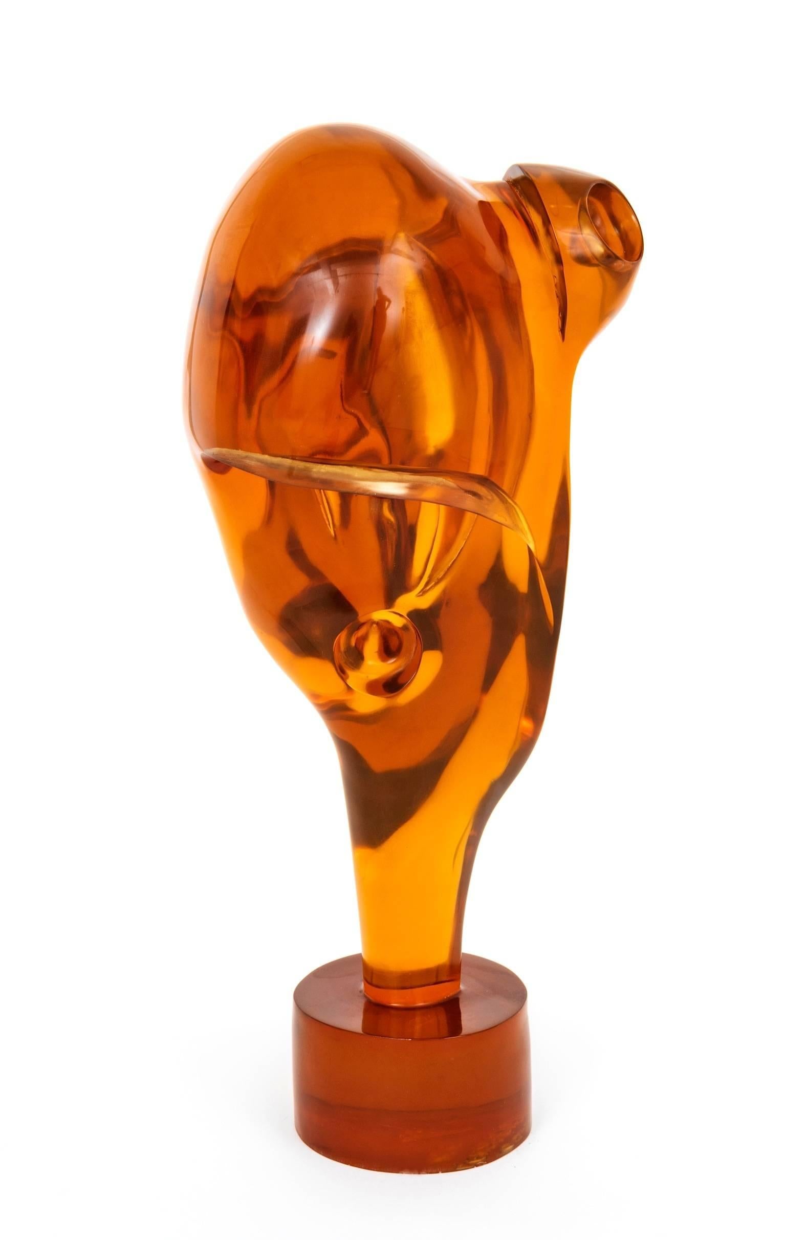 Stunning and large pop of orange 1970s resin or lucite sculpture by Henry Guerriero. Henry was represented by the Silvan Simone Gallery in LA during the 1960s and 1970s. While he worked in bronze he turned towards lucite in the mid-1970s so he could