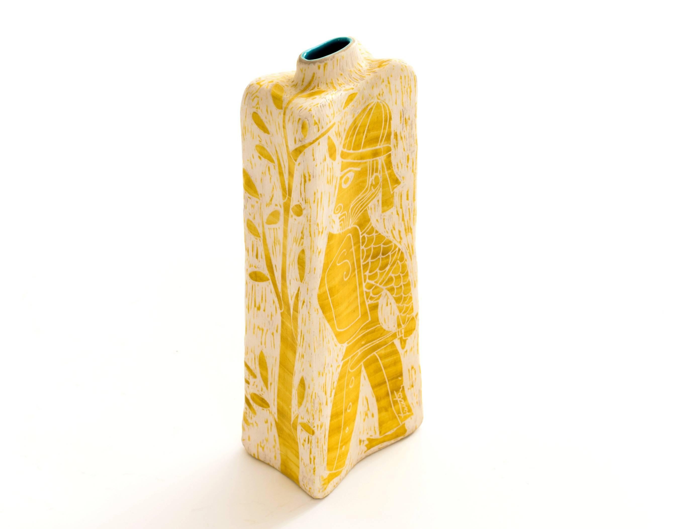 Rare and Superb Marcello Fantoni ceramic warrior vase in relief with canary yellow and off-white with a turquoise interior. On the reverse is a graphic tree as well as the sides of the vase. Signed Fantoni on the right leg and Fantoni, Italy on the
