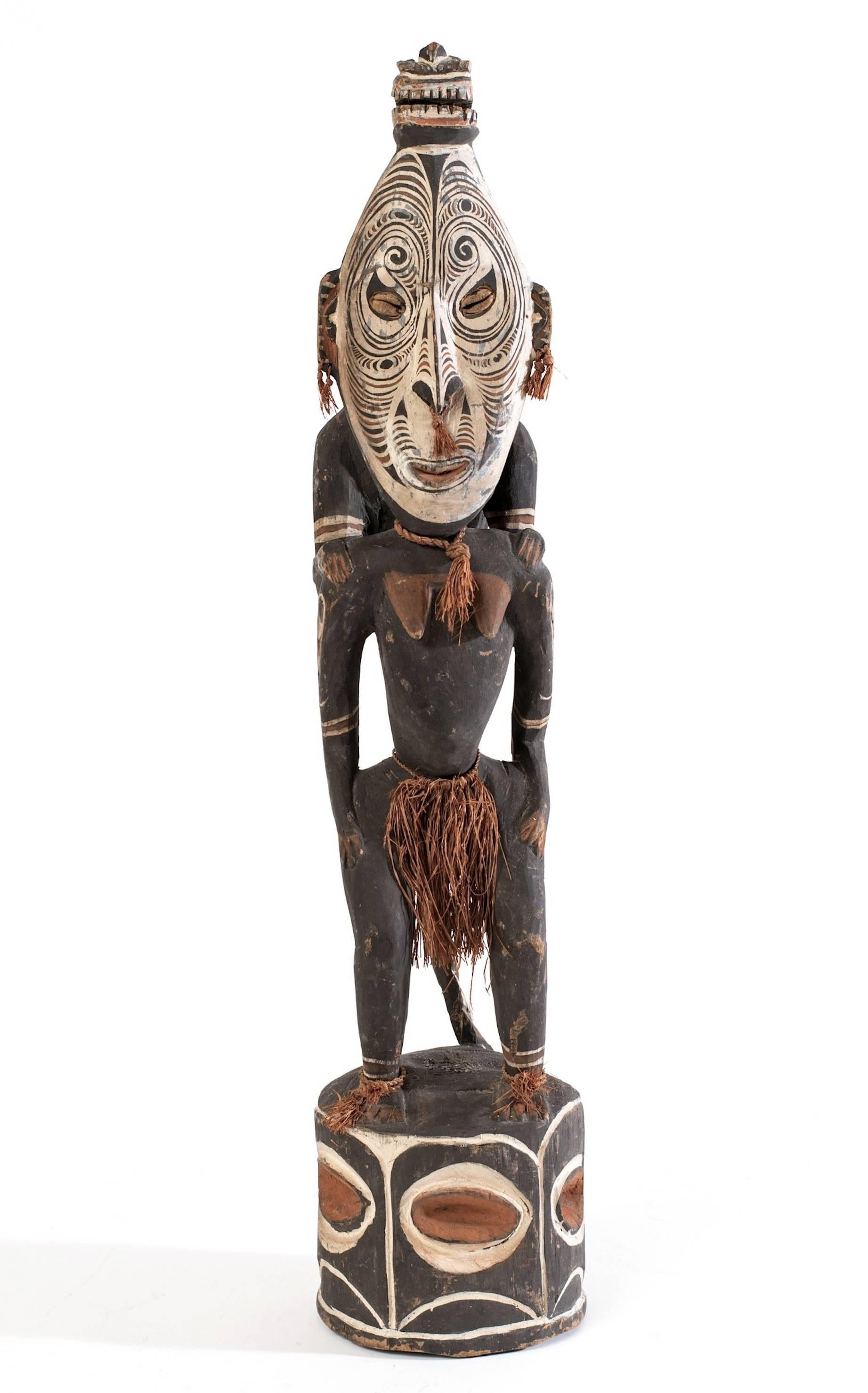 From a private collection comes this great Oceanic Papua New Guinea gable figure. This piece is both beautiful from the hand-carving to the symbolism.
Gable figures are almost always a human figure surmounted by a bird and placed on top of the