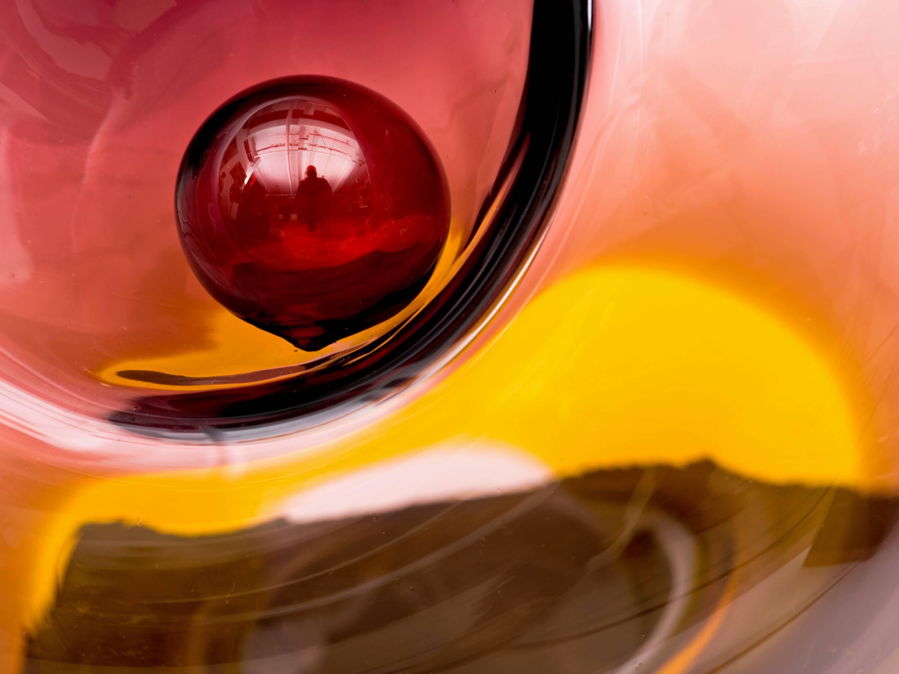 Extraordinary Massive blown glass sculpture with two recessed areas for balls by Czech Artist Jirina Zertova, circa 1974. Exceptional statement piece in colors ranging from cranberry red to darker shades of red in the balls to a splash of gold at