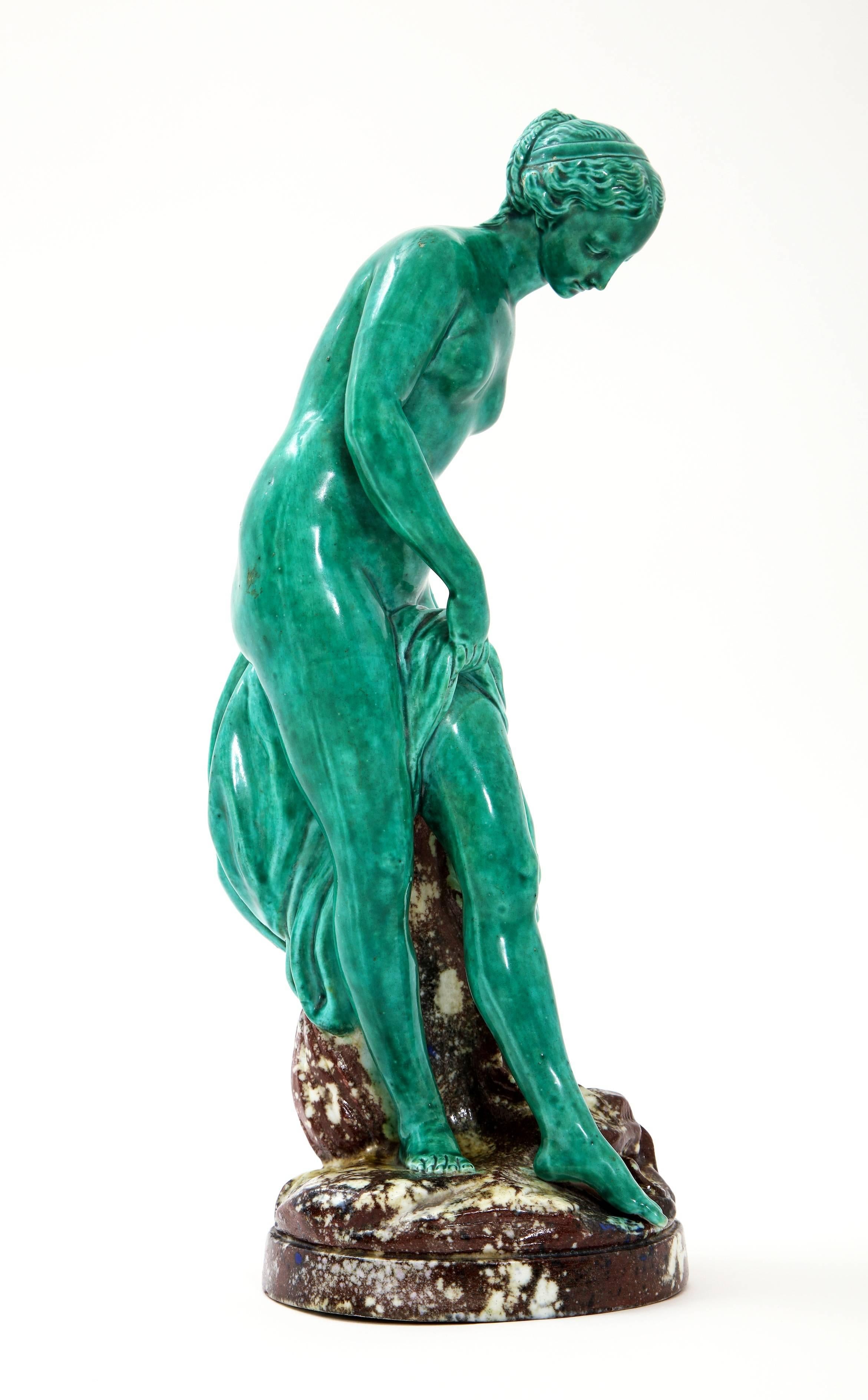 Fabulous and Quite Unique French Majolica Sculpture of Diana circa 19th century.  This beautiful nude sculpture with drapery over her leg is a stunning shade of turquoise set against a mottled brown base with seashells and other elaborate details. 