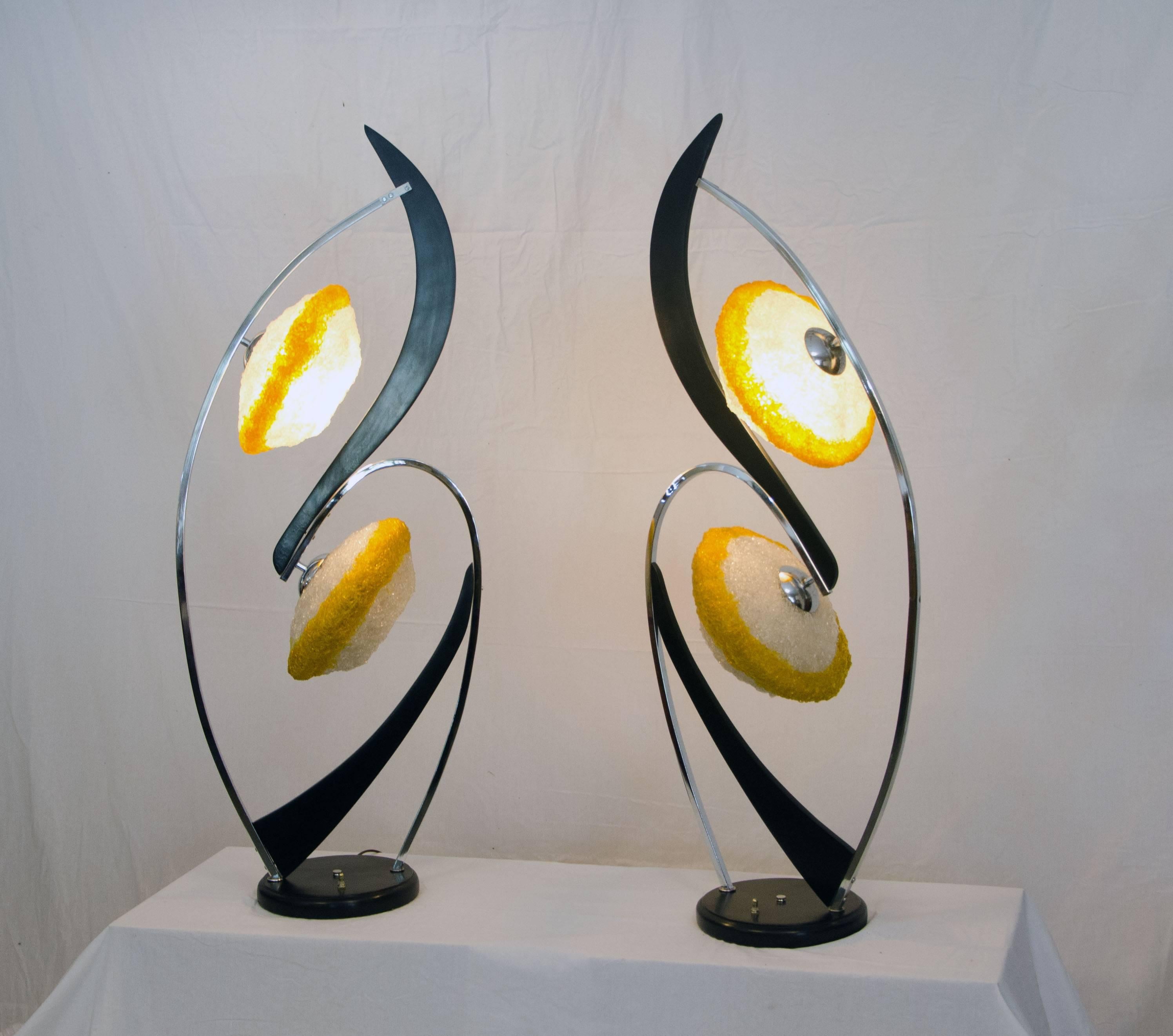 This wonderfully outrageous monumental pair of lamps will really make a statement. Manufactured in the 1950s by The Majestic Lamp Company, NYC. which ended production in 1963. Acrylic spaghetti shades are two toned. All parts of lamps are original,