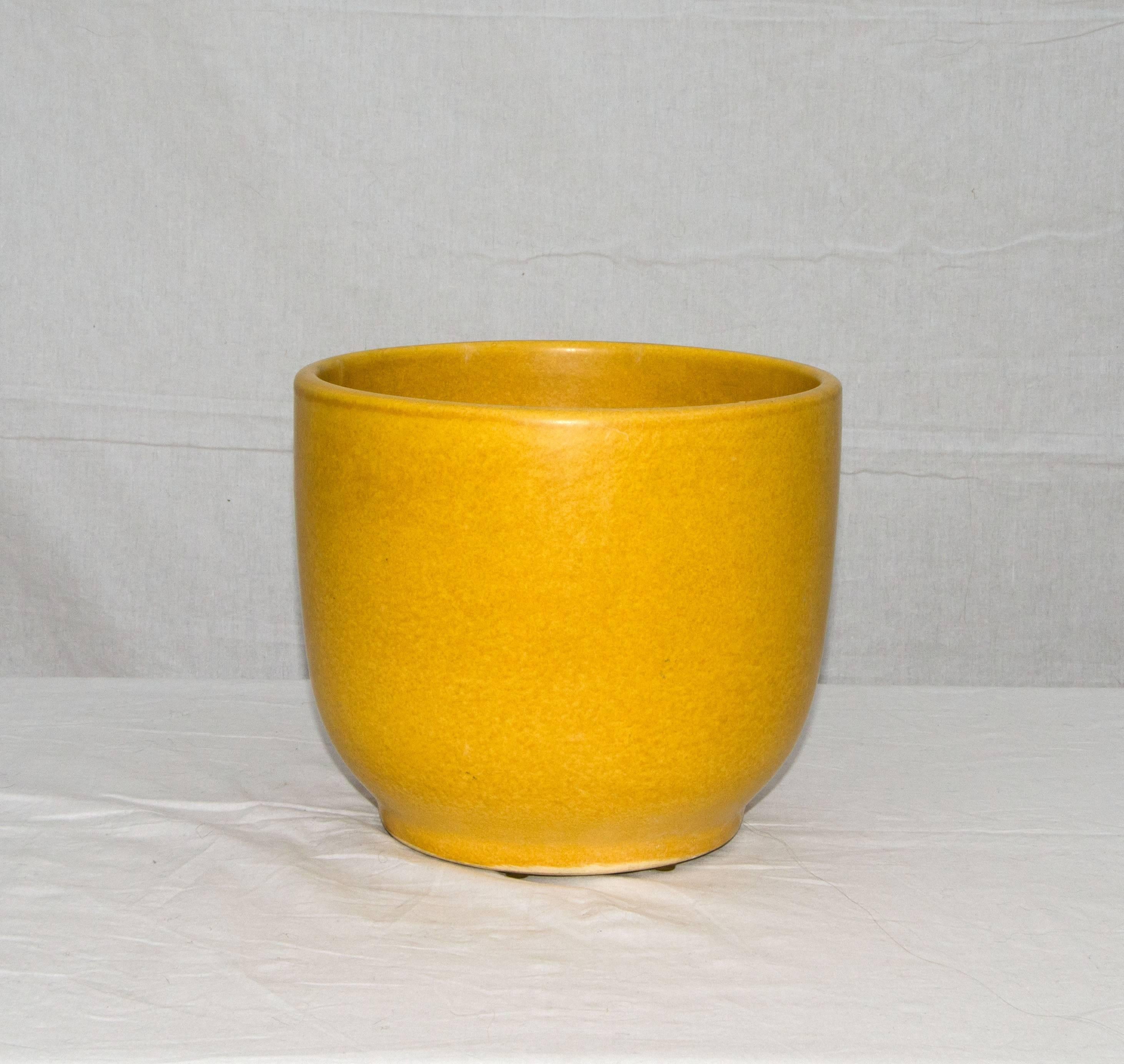 Very nice ceramic pot or planter by Gainey Ceramics of La Verne, California. Best used with another pot to fit inside as there is no soil drainage hole. Beautiful yellow color. Marked on bottom as shown.