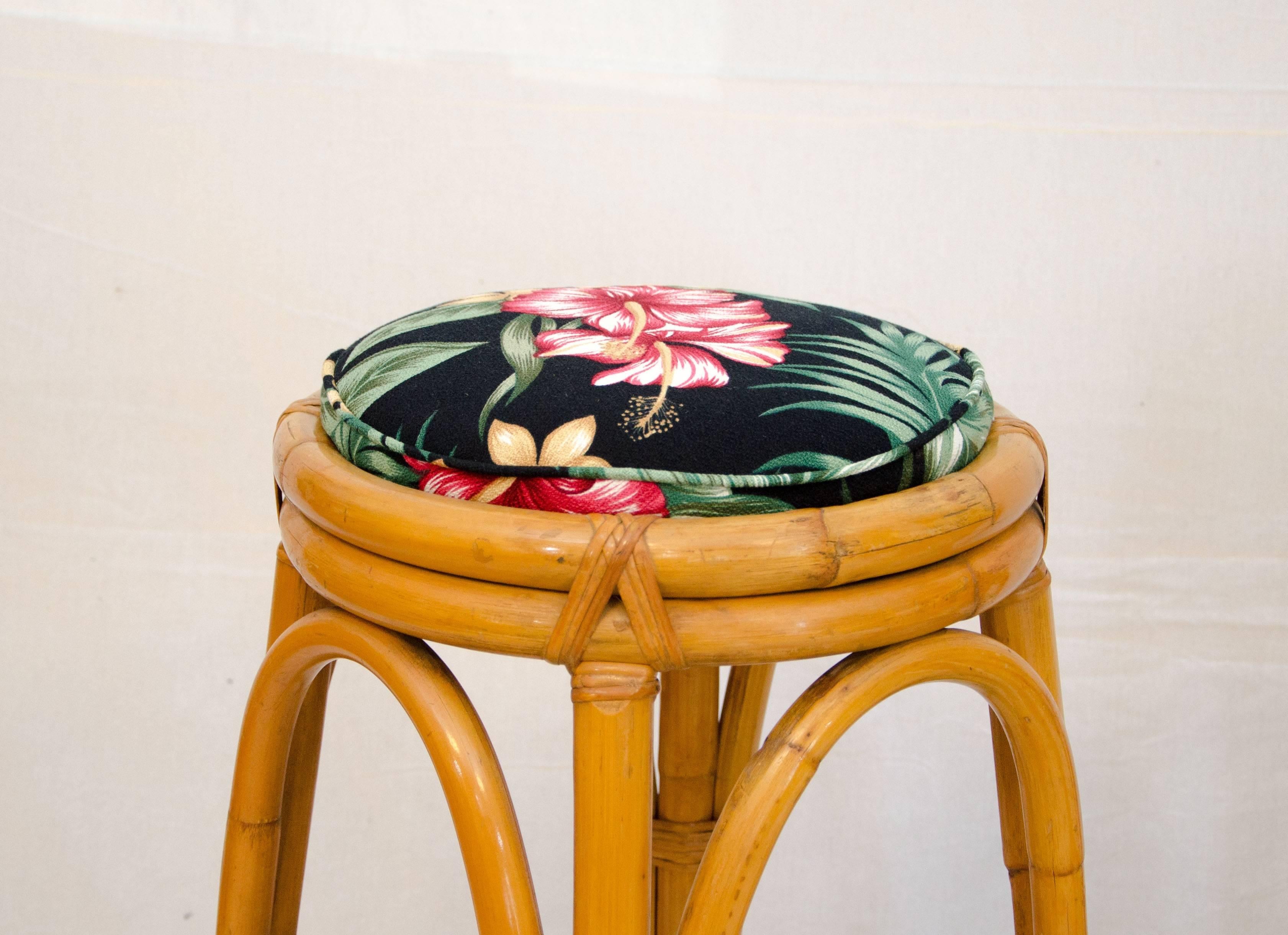 Nice pair of bar stools or counter stools to accent a tiki or tropical themed interior. Seats have been reupholstered with a tropical themed fabric. Seat is 14