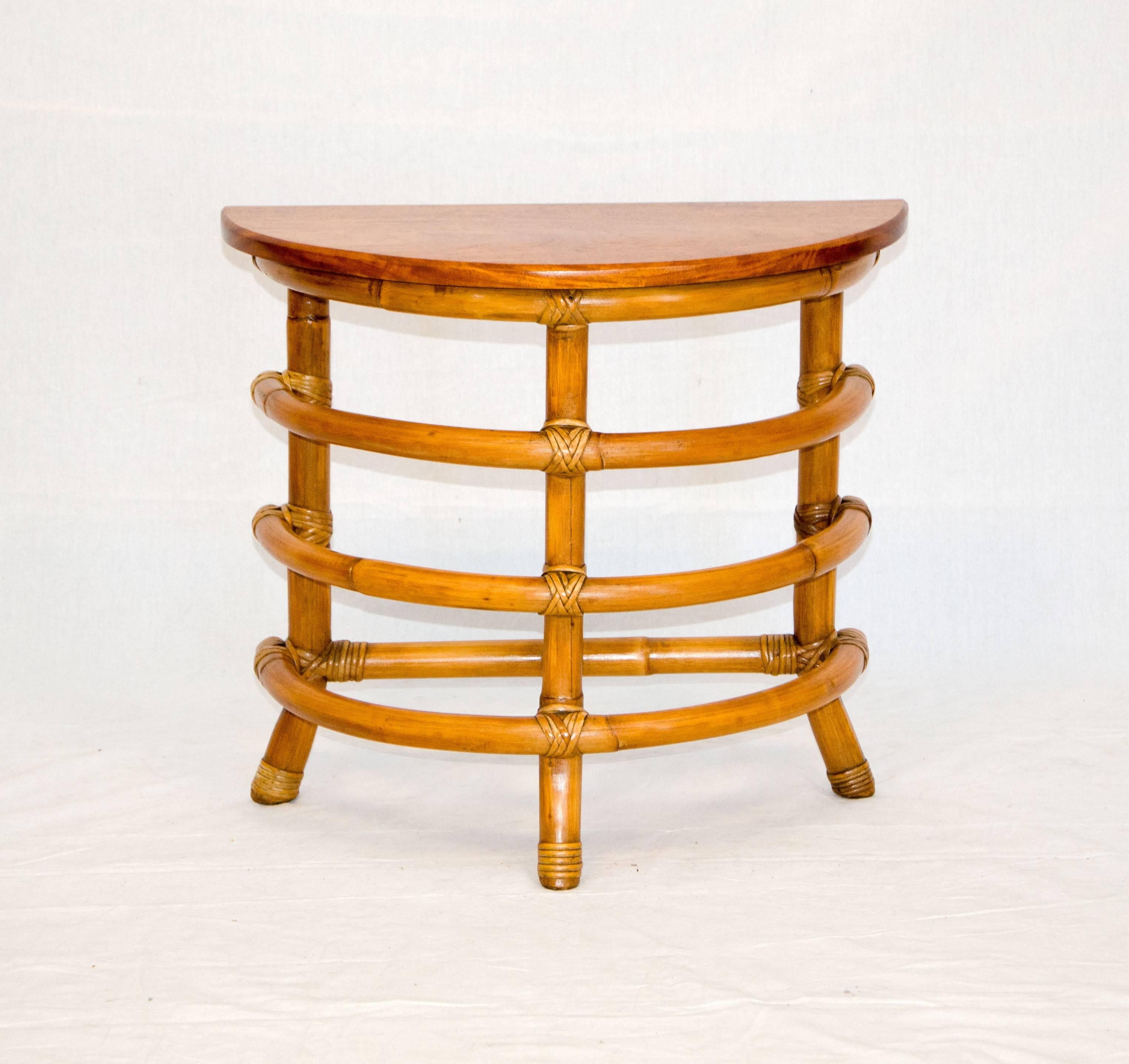 Pair of small rattan furniture items to accent your interior.
Half round side or accent table: Rattan and solid Koa (monkey pod): 22" wide by 11' deep and 19 1/2" tall.
Two-tier circular stand: Rattan and solid mahogany, 25" tall 13