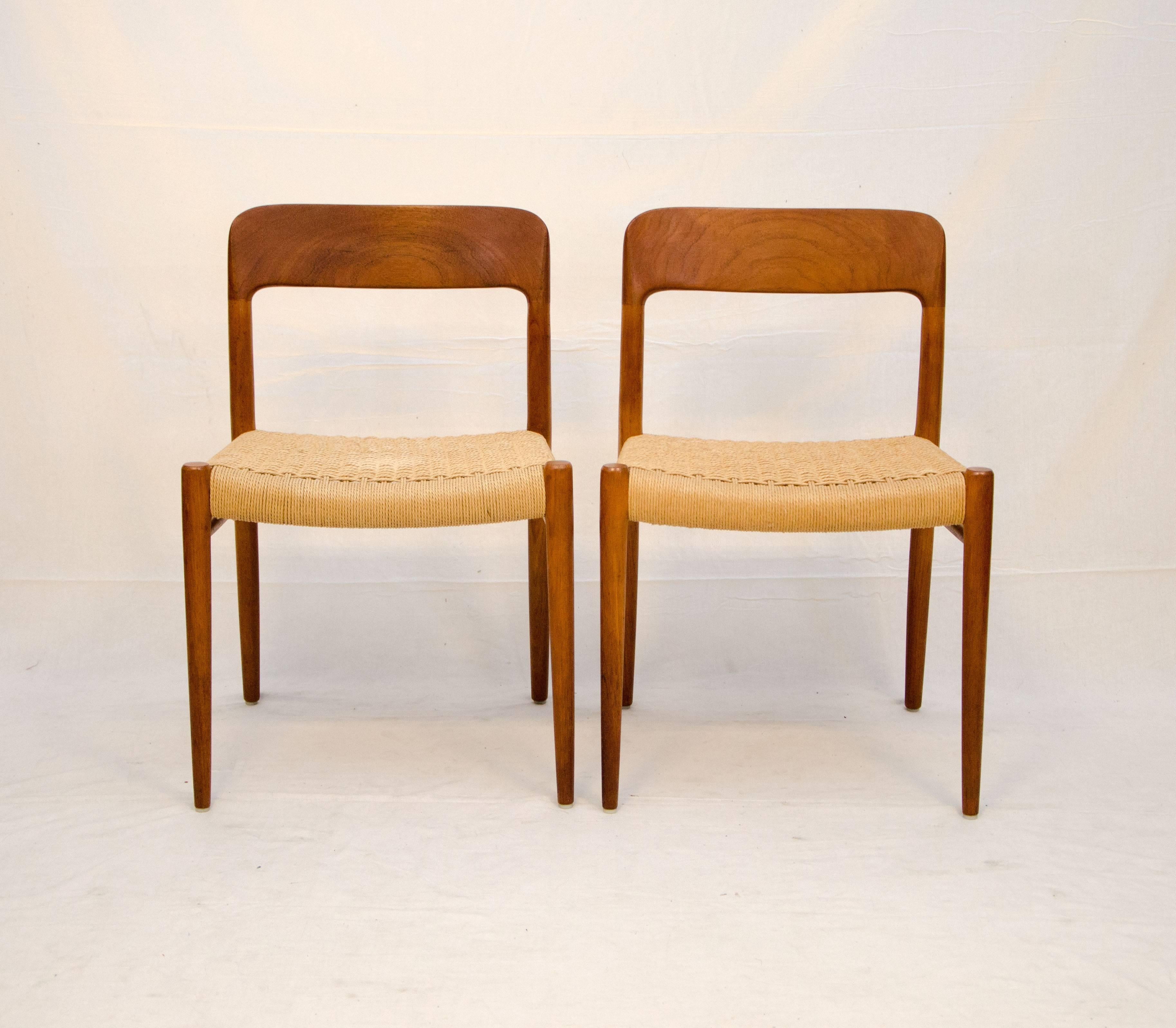 A beautiful pair of teak Danish Mid-Century Modern dining chairs by Niels Otto Møller for J.L. Møller. This model was Møller’s second ever design and proved to be very popular. The backrest is sculpted out of solid teak and gives the chair its