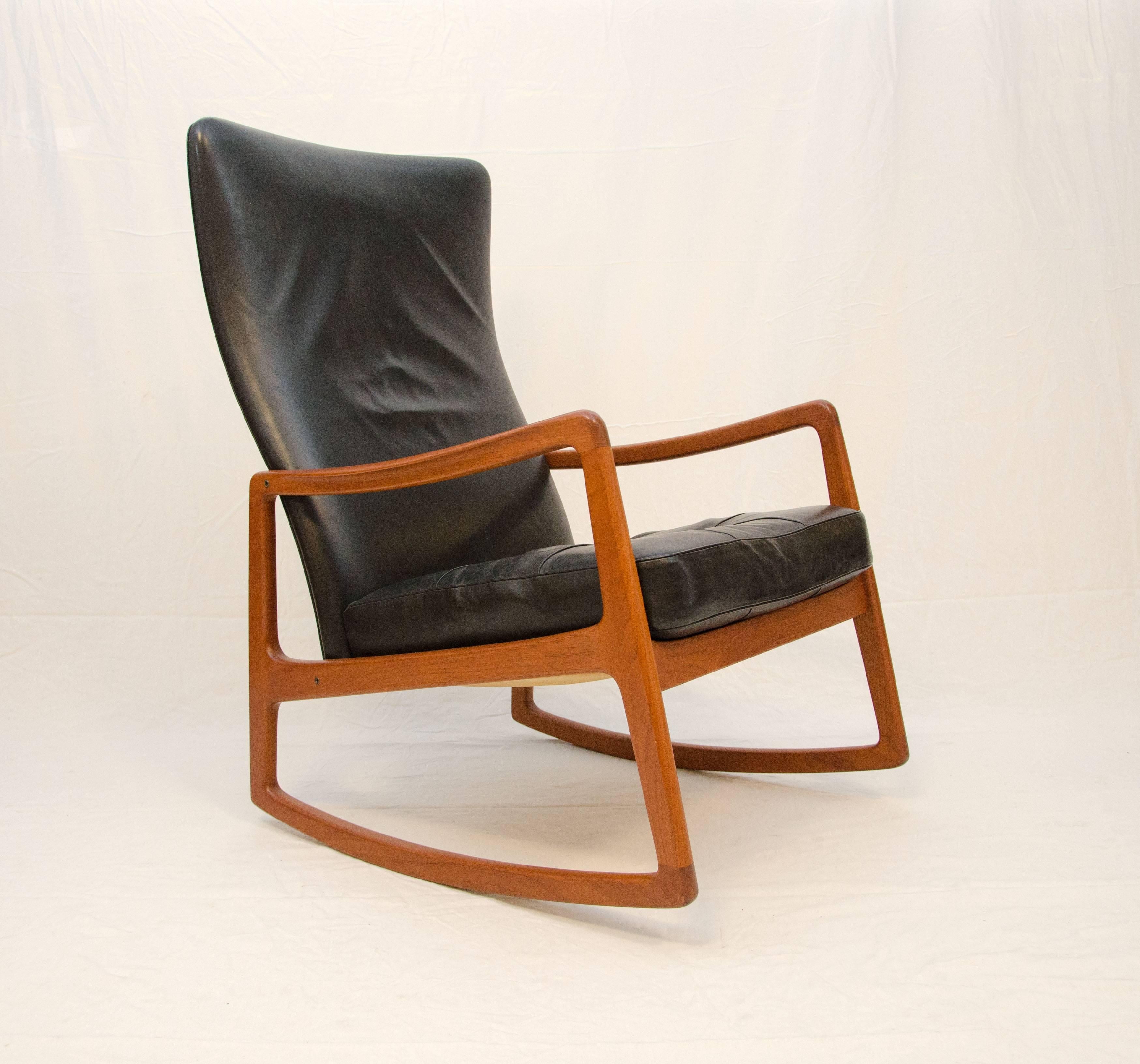 Comfortable and stylish high back rocking chair designed by Ole Wanscher and manufactured by France and Son in the 1950's. This high back model is difficult to find. Seat cushion is removable.