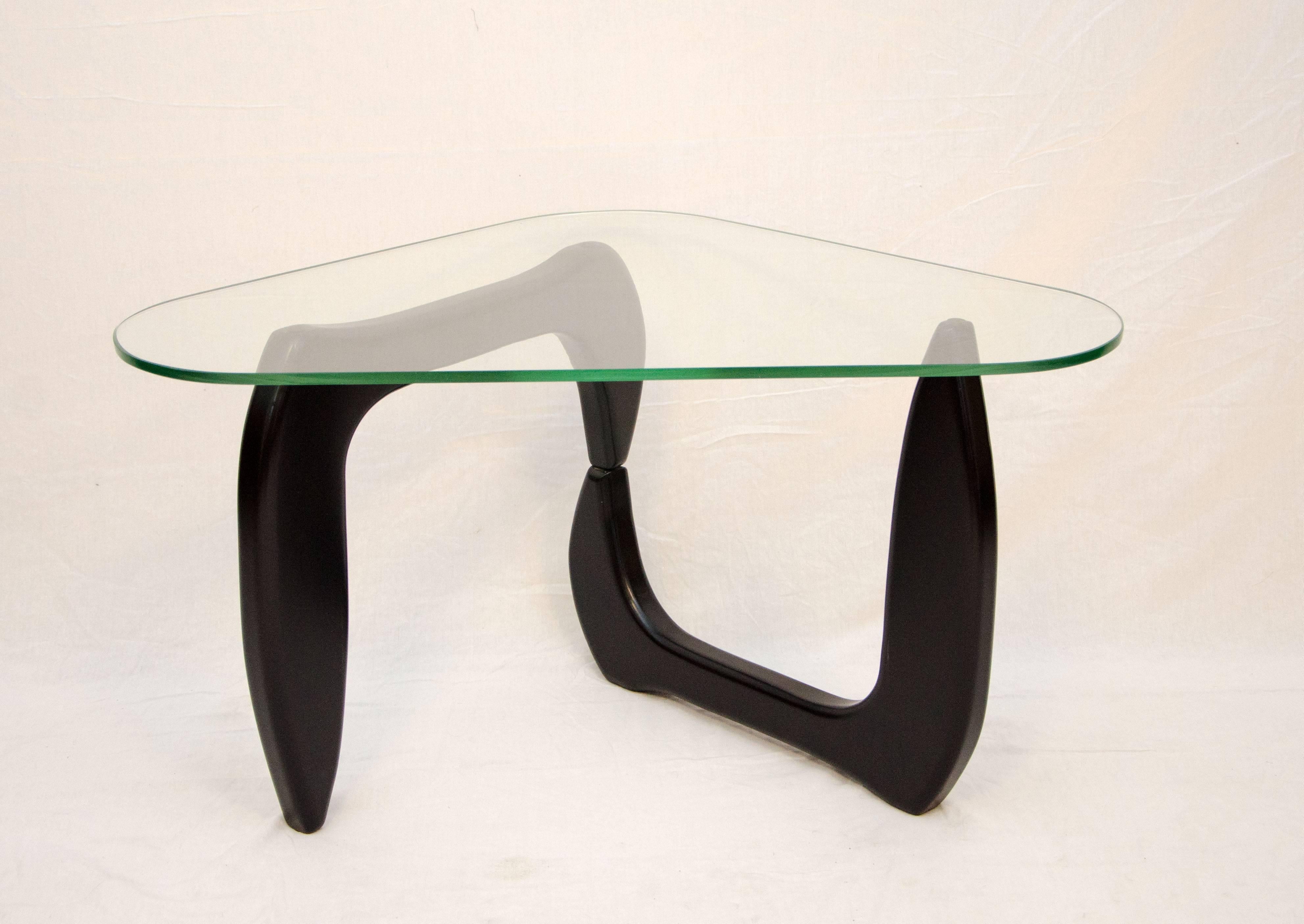 Nice Noguchi style occasional table can be positioned in several different ways by changing the base and tabletop configuration, would work well between two angled lounge chairs with the short side in front. Measures: 1/2