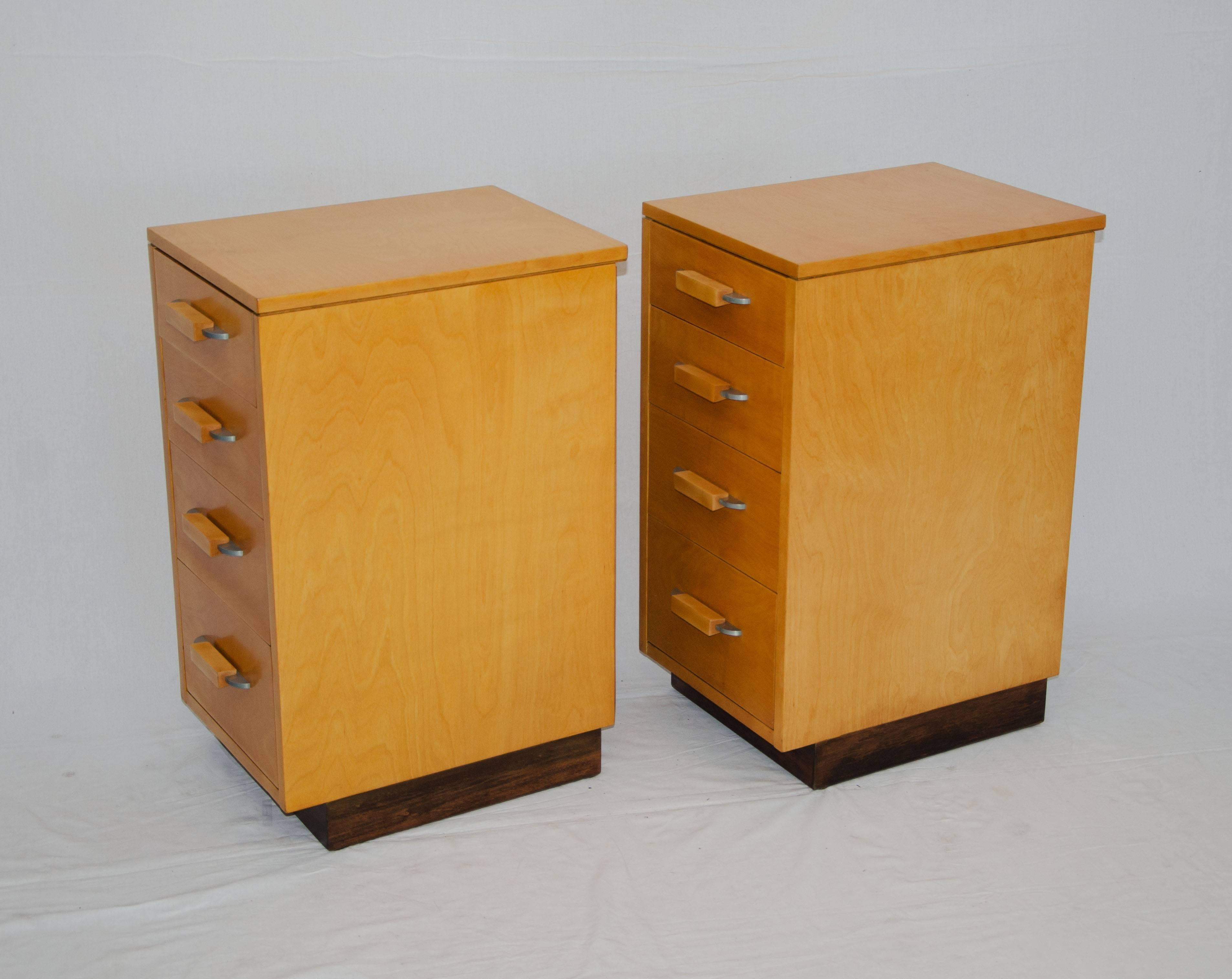 These two small chests allow storage in small spaces or could also serve as night stands. Designed as a modular system known as the 