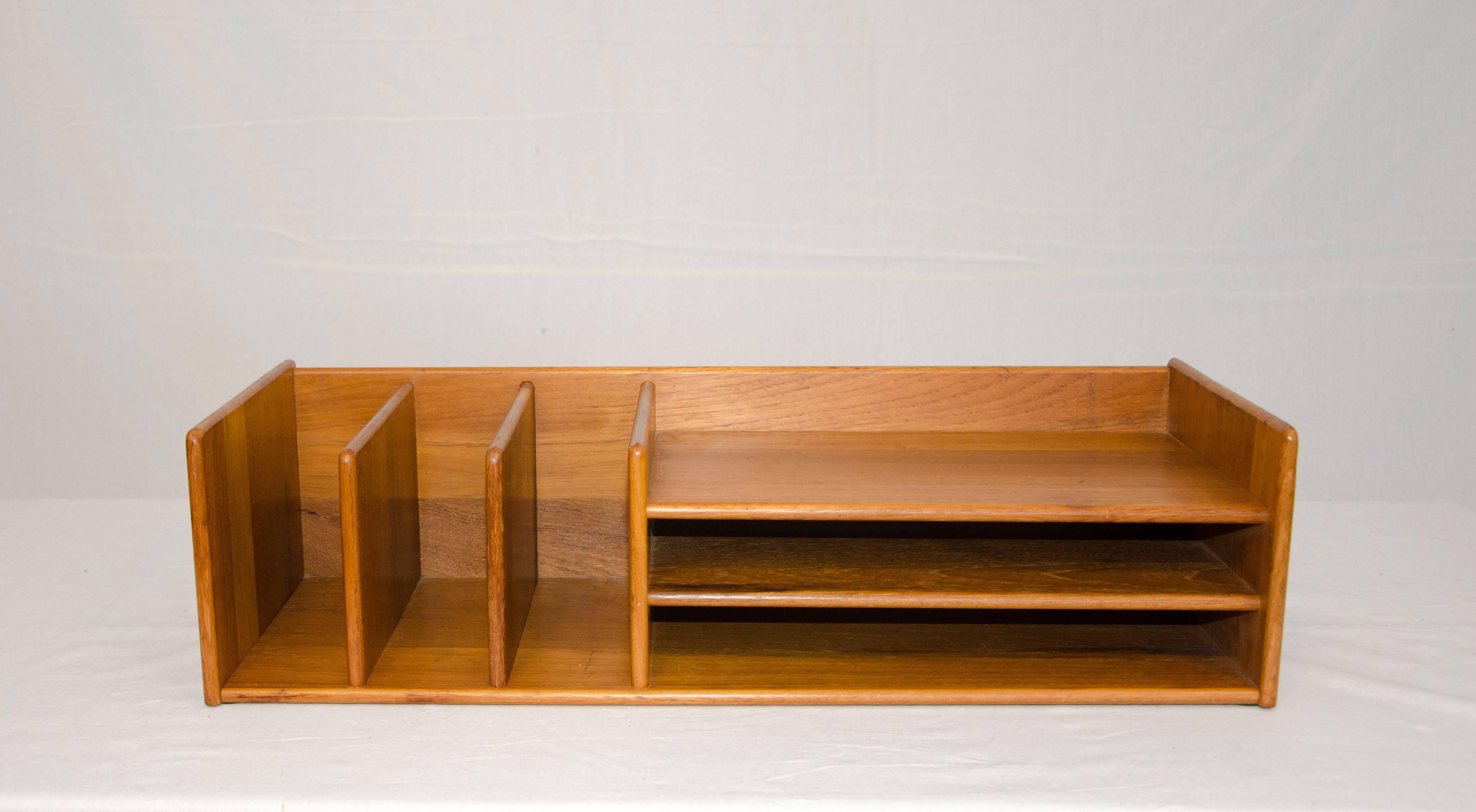 Nice Danish teak desk organizer with six storage compartments. Original tag attached on underside Nordisk Andels-Eksport ( Nordic Export Cooperative ).
Manufacturer attributed to Georg Petersens.