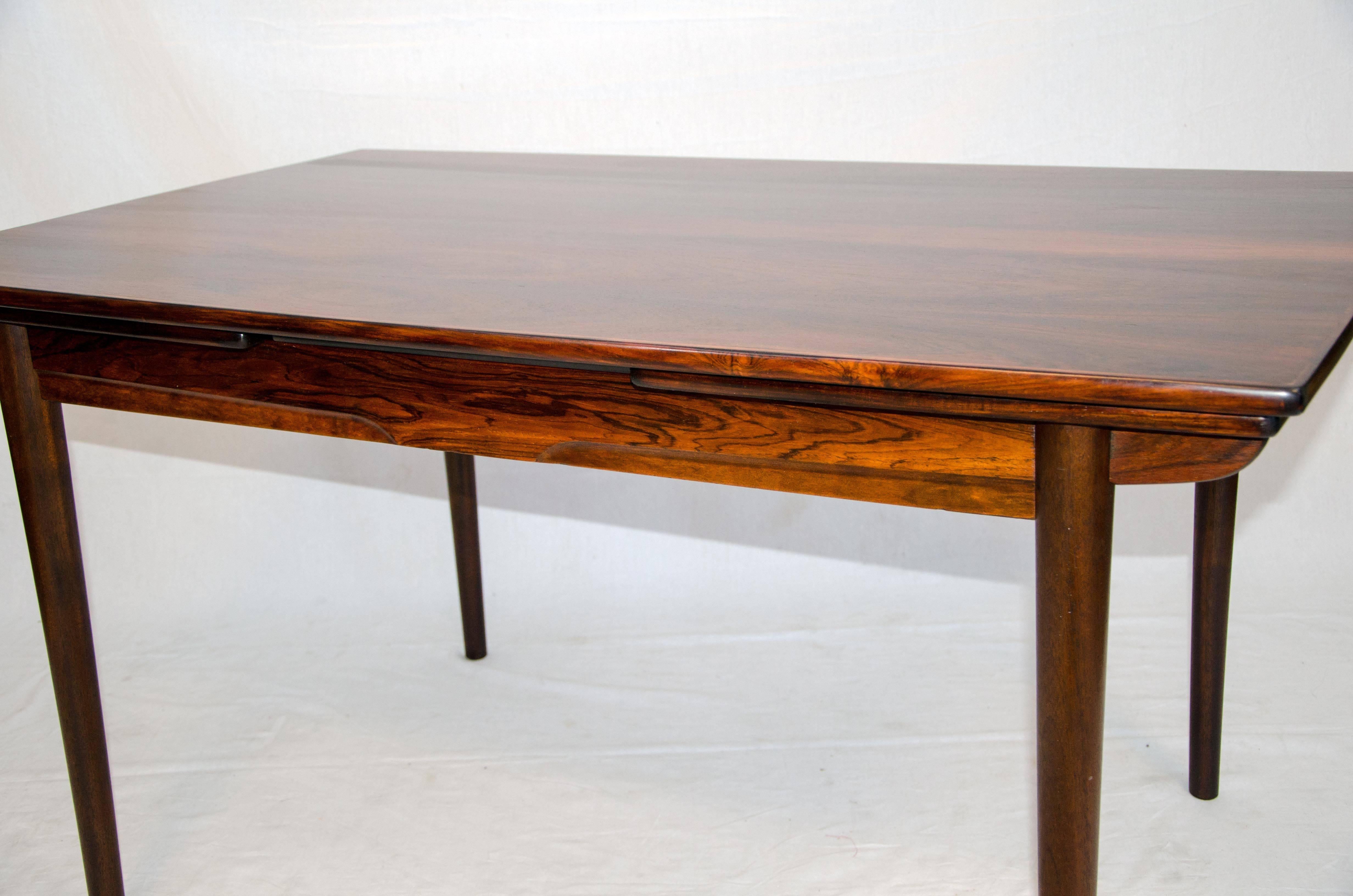 Very nice smaller size Danish rosewood dining table with two 18