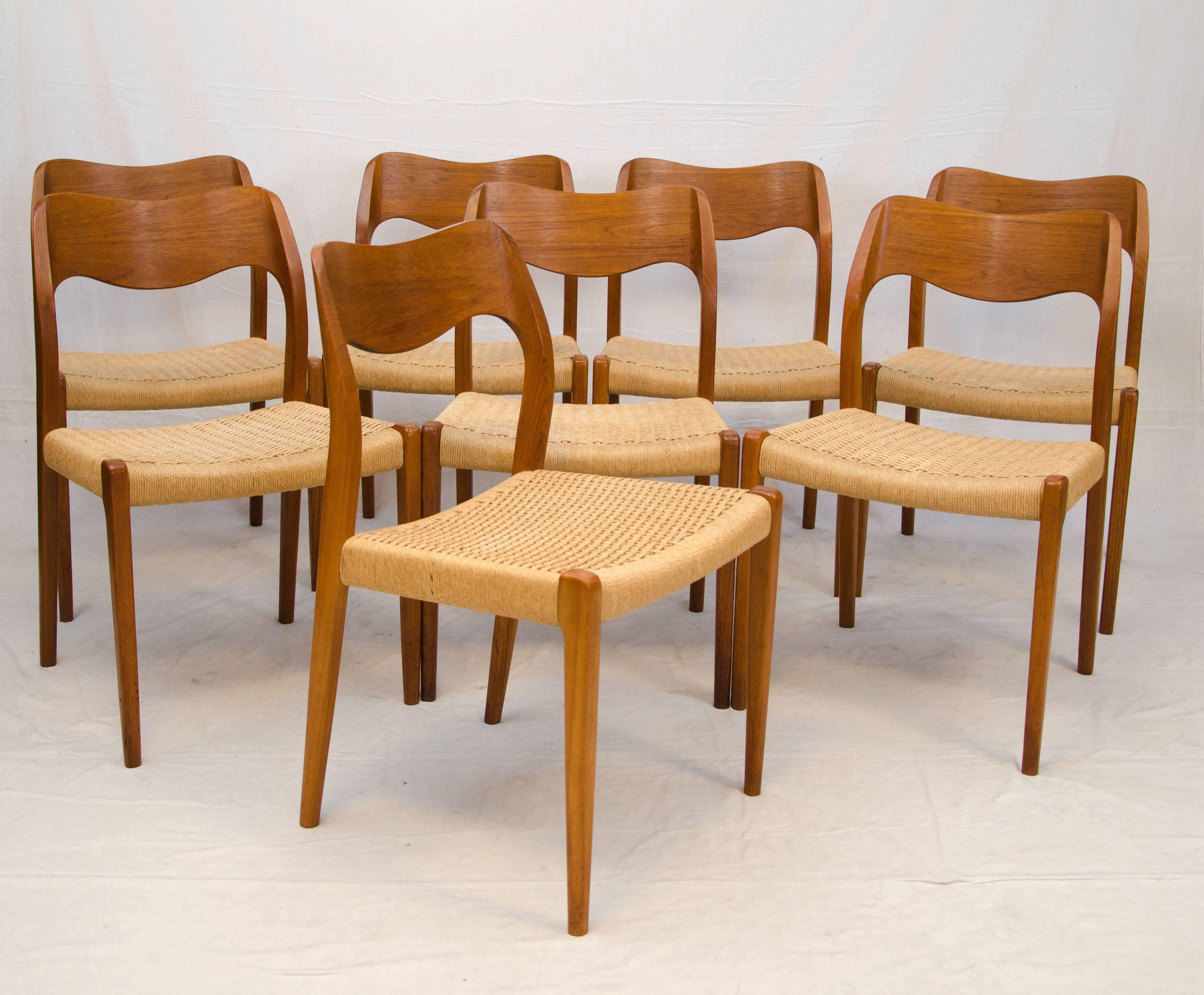 Set of iconic Møller model 71 Danish teak dining chairs with clean original Danish cord seats and comfortable sculpted backs.