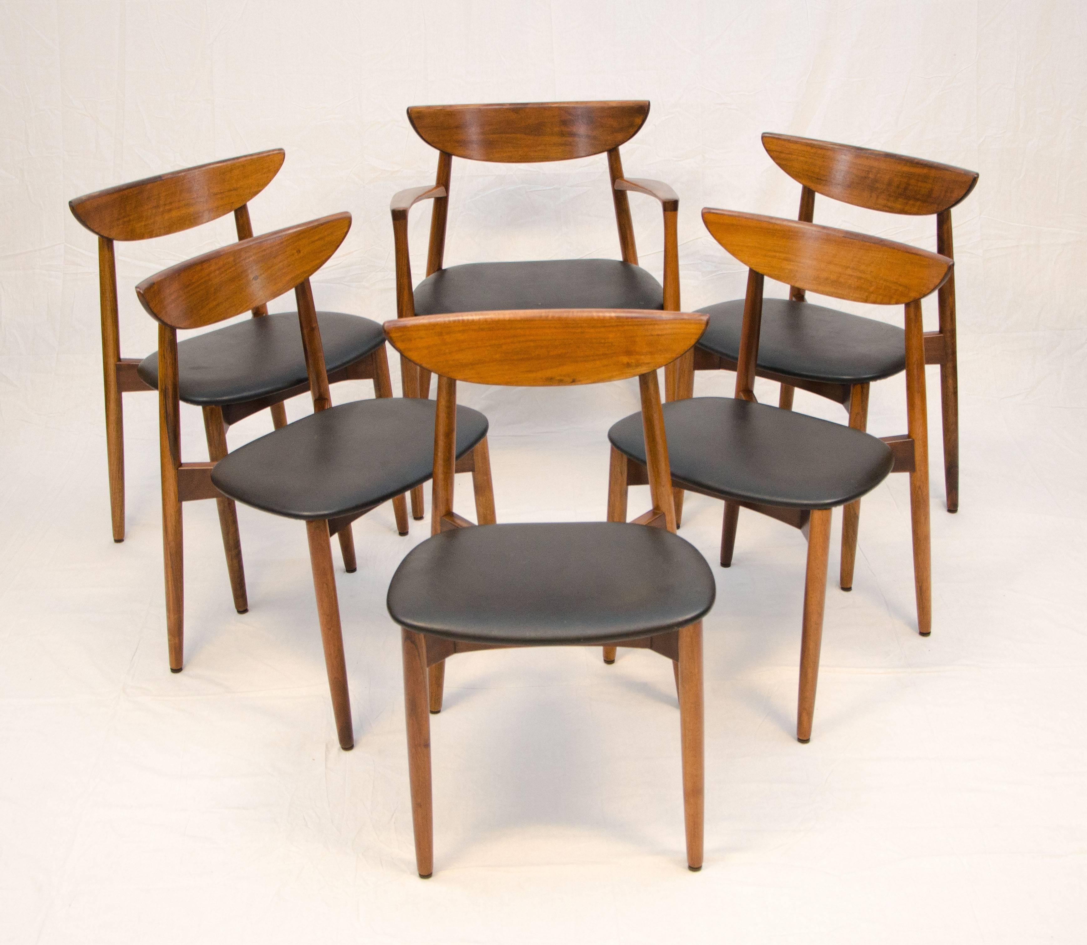 Nice set of six Danish walnut dining chairs designed by Harry Ostergaard and imported my Moreddi. The armchair is slightly larger than the side chairs. Measures: 23