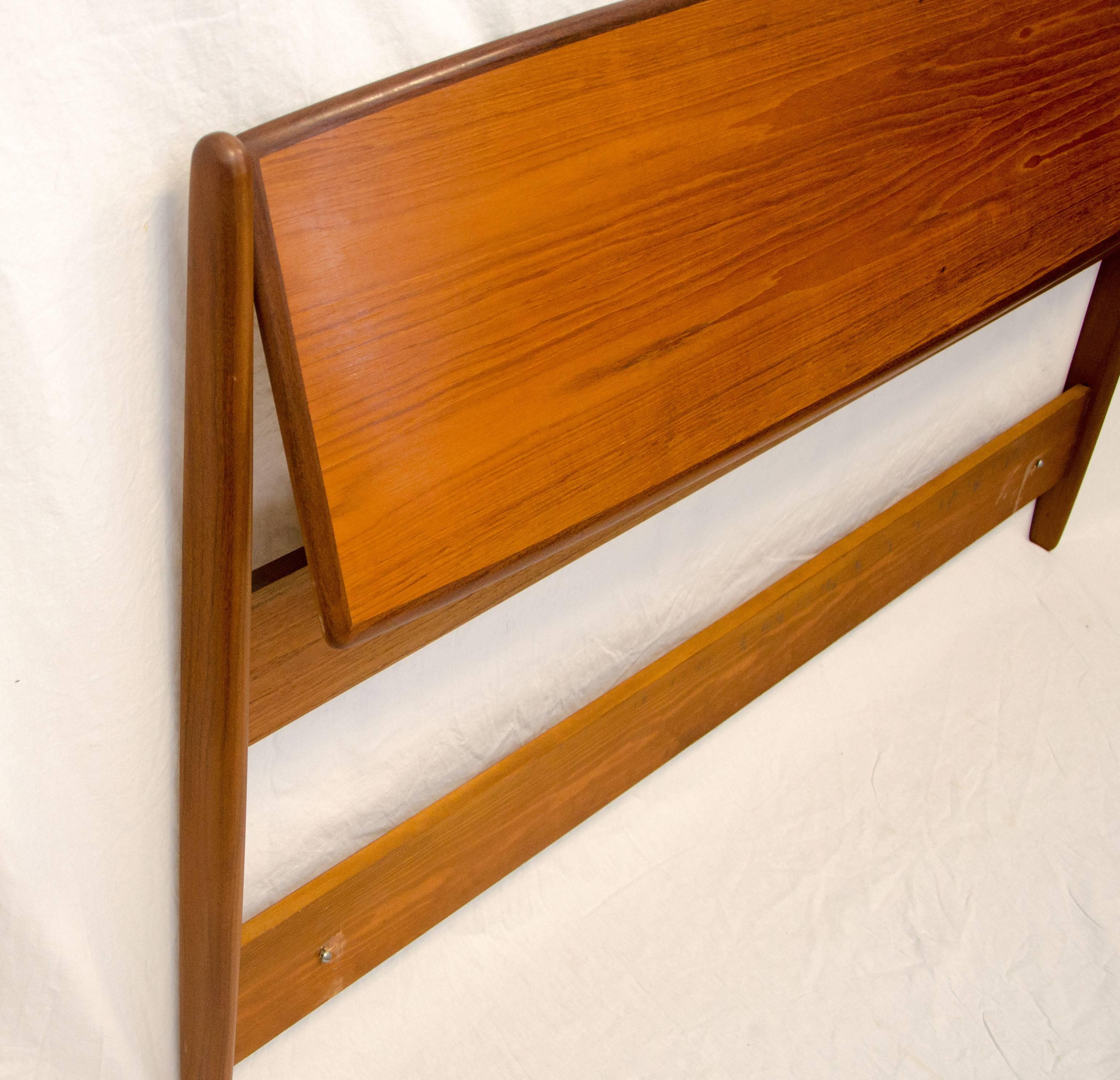  Nice queen size Danish teak headboard with walnut edge accents. Headboard tilts for sitting up or reading in bed.