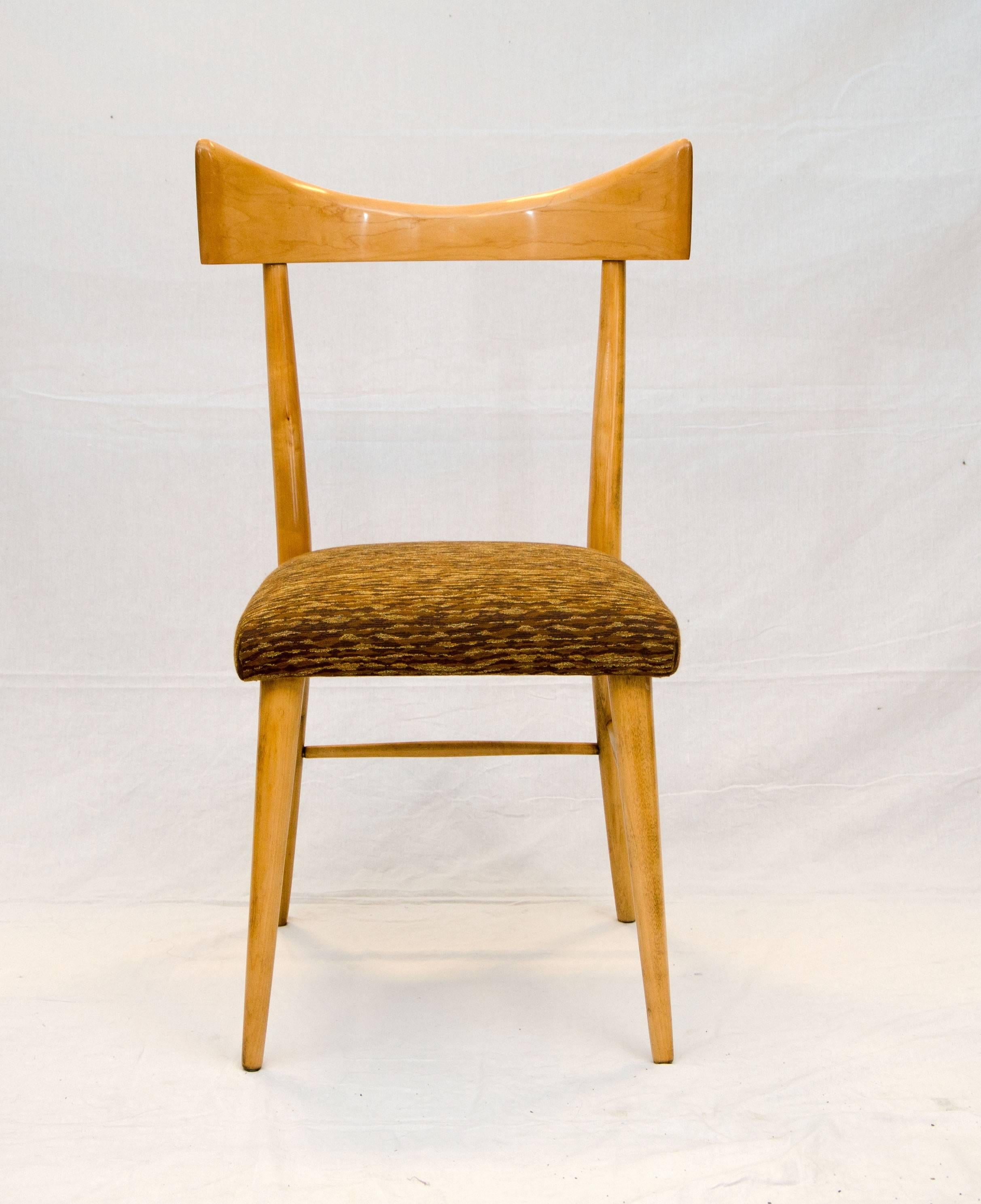  Nice single Paul McCobb chair for accent or desk. Has a bow back design and upholstered seat. The seat fabric is very vintage style with a gold thread running through it.