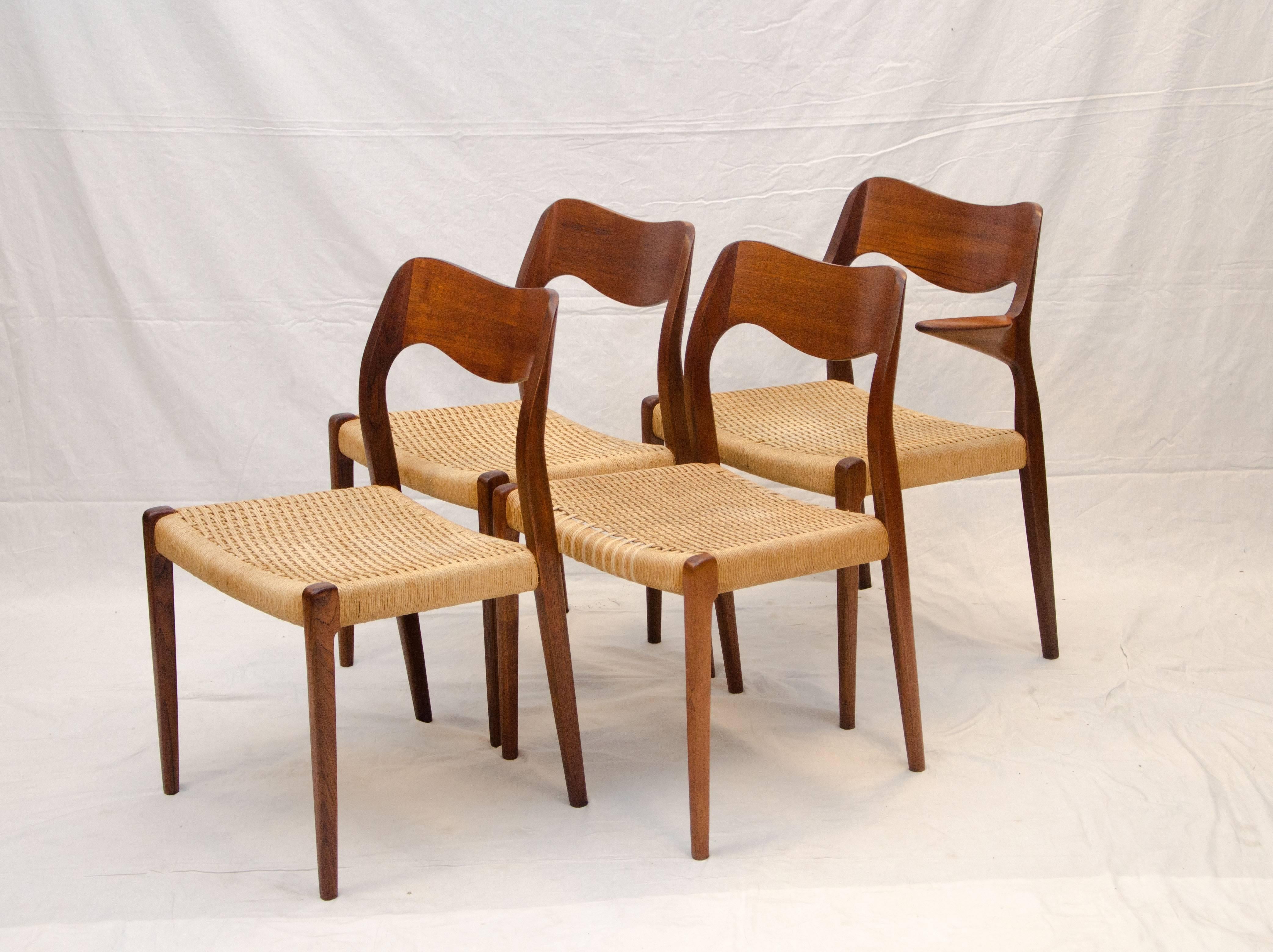  Set of four Danish teak Moller dining chairs. Side chairs are #71 and the arm chair is a #55 with a very natural stylish small arm design. The cord seats are original with a partial reweave on one side chair. One more side chair (also partial