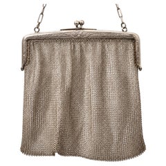 French Belle Époque Silver Mesh Handbag with Ornate Clasp and Bracelet Handle