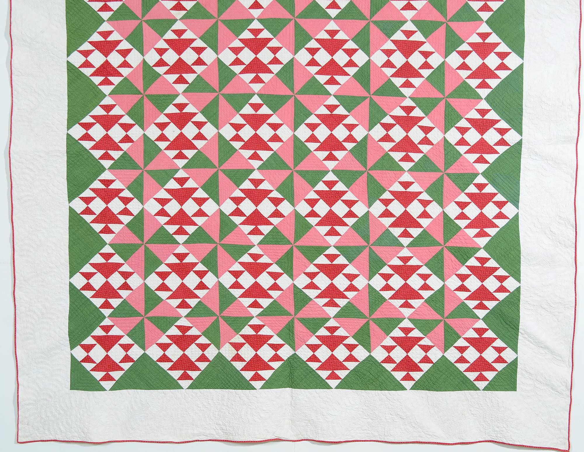 This beautifully crafted quilt combines two traditional patterns that I have never seen abutting one another. The red and white blocks are fox and geese (aka double X or crosses and losses). Placing them next to the pinwheels of such different