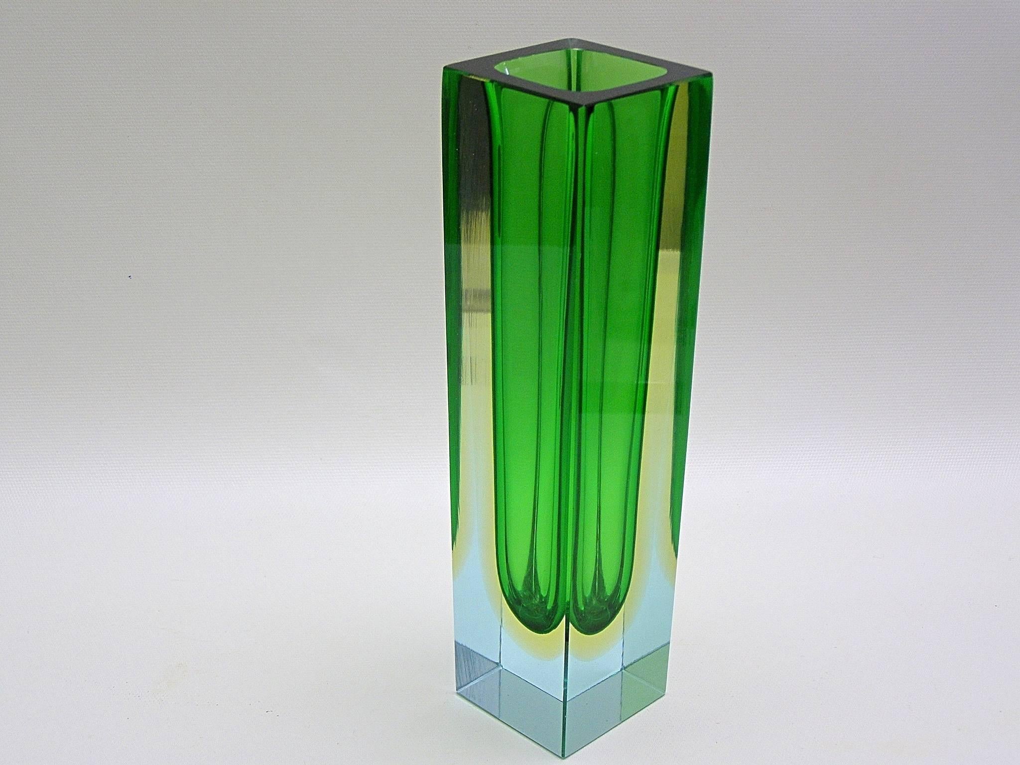Beautiful Mandruzzato Murano glass vase in triple Sommerso-technique showing the pale blue glass block with rich green interior surrounded by another layer of pale-lemon yellow. Fantastic from every angle with or without flowers.