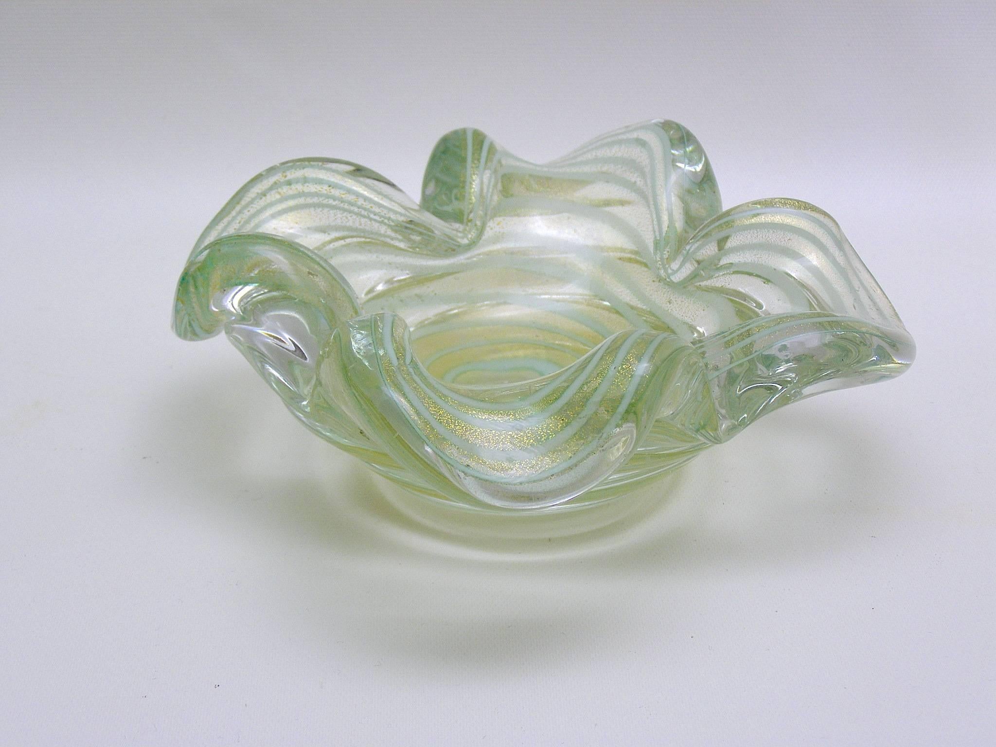 Handblown Murano glass vide-poche/ catchall/ round dish in beautiful green and gold flecking with light aqua swirls running through it. Beautiful on display and also a useful piece of functional art glass.