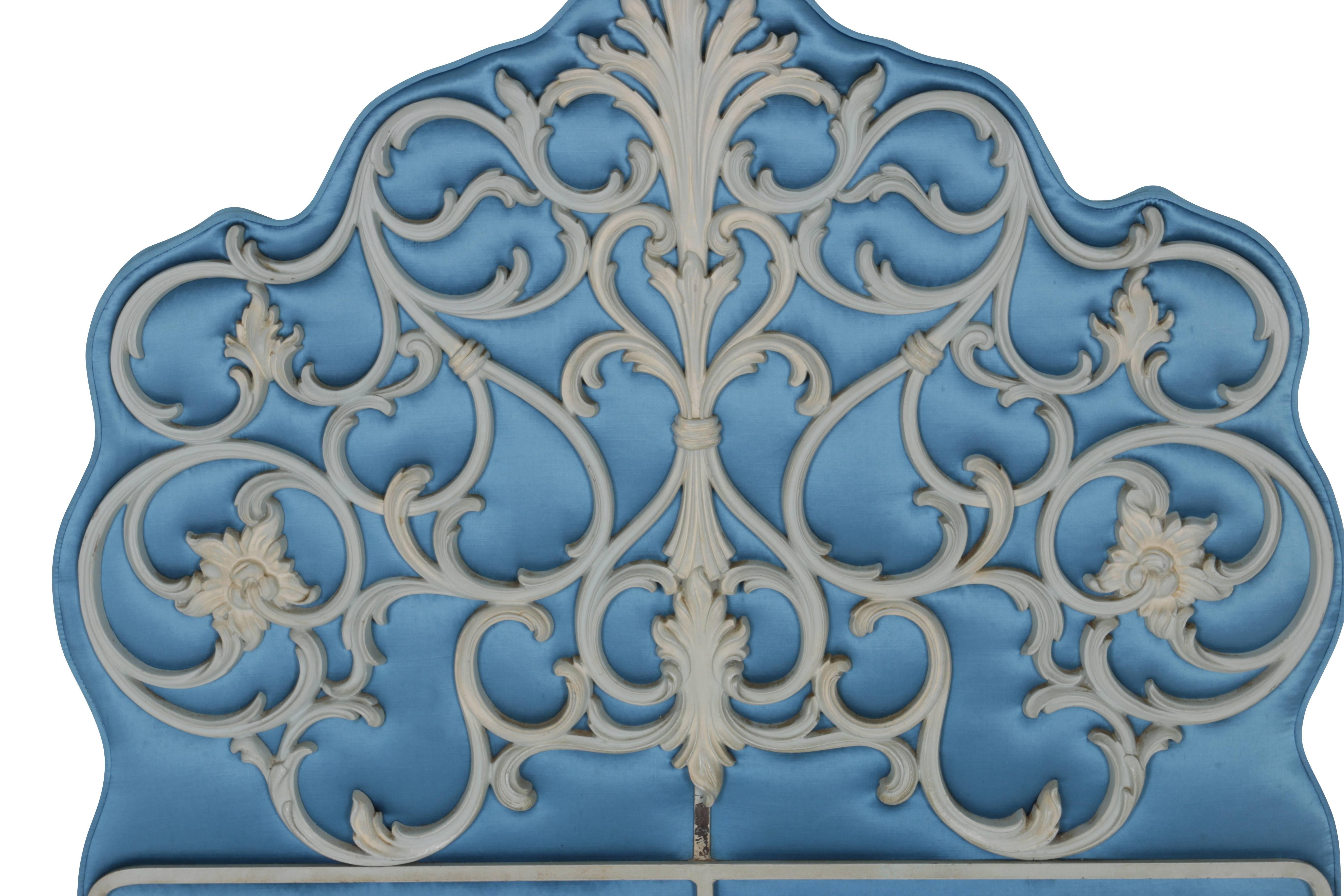 Fantastic pair of twin-size headboards in bluejay blue padded silk fabric with ornate metal fleur-de-lis design and swirls. Heavy gage metal and padding make these headboards strong and weighty. Can mount directly to bed frame or can be leaning