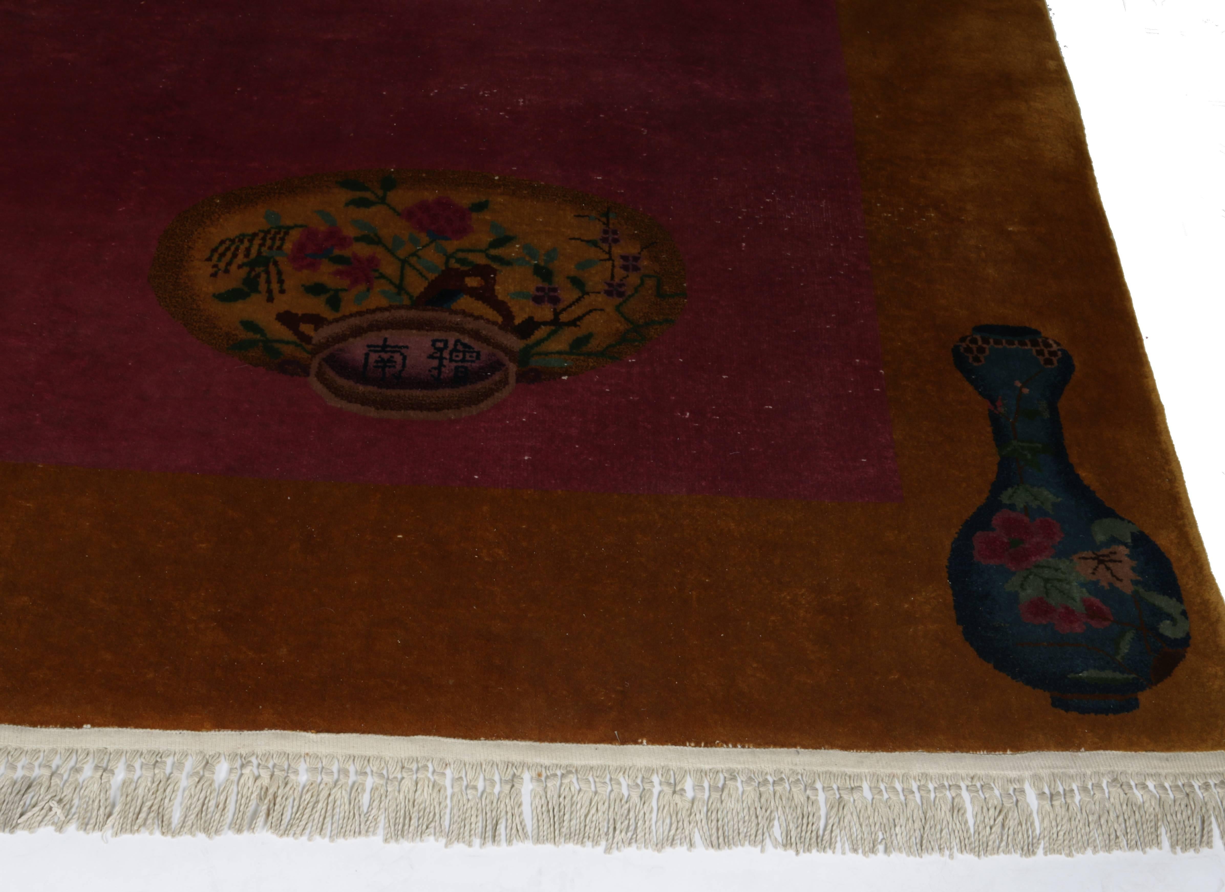 A splendid Minimalist Chinese Art Deco rug with a trompe l'oeil design of a pot and another trompe l'oeil design next to it depicting the bottom of the pot showing a signature. All in all a surrealist and three-dimensional rich deep burgundy colored