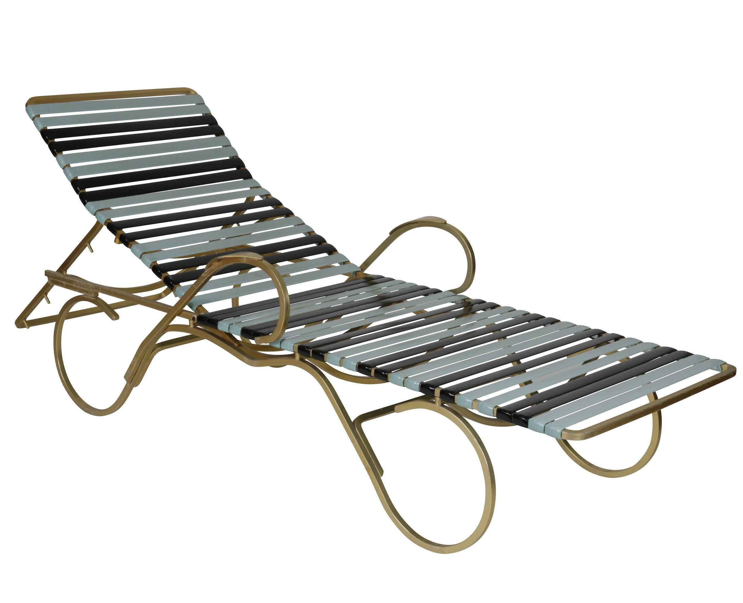 Two fabulous chaise longue with brass electro-plate curled metal frames and two-tone rubber straps in pale Mid-Century blue and midnight black. Lovely curves all the way around, these chaises longue look wonderful on display in the garden and at the