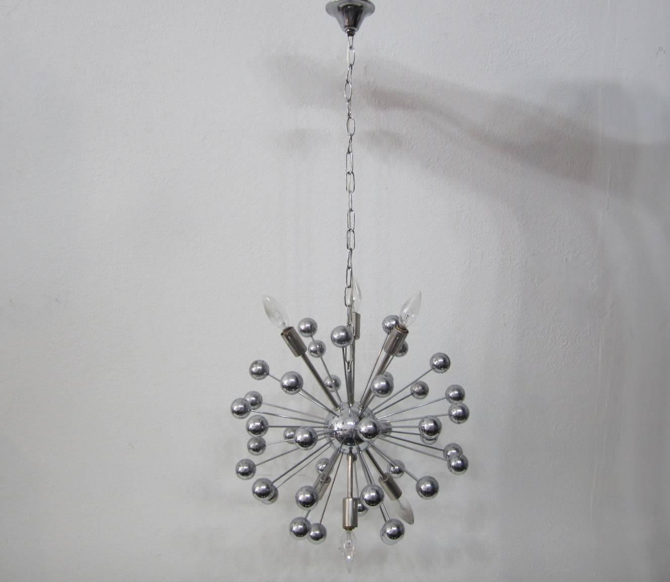 Hanging sputnik pendant chandelier in nickel. Metal rods that terminate with nickel plated plastic spheres are interspersed with the arms holding the sockets. Canopy and adjustable chain included. Rewired to US standards and takes six 60-Watt