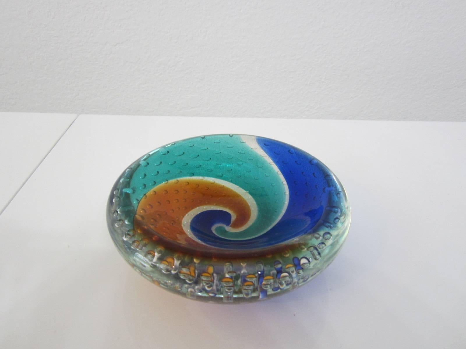 Gorgeous handblown Murano glass bowl with swirls of aqua, cobalt, and amber and filled with controlled bubbles and gold leaf flecking. Beautiful smooth shallow-dip bowl great for display and for utilitarian use.