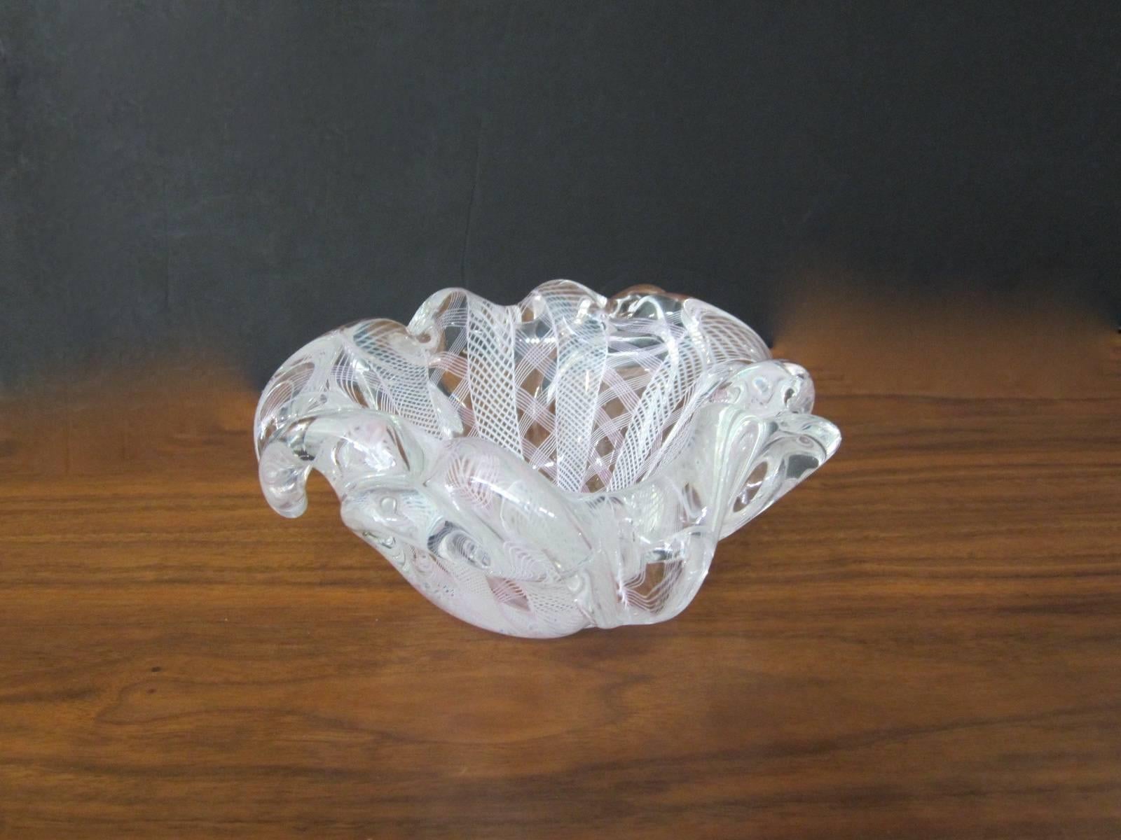 Beautiful handblown Murano glass catchall bowl done using the zanfirico technique which was brought back to use by Antonio Sanquirico in Murano, Venice, Italy.