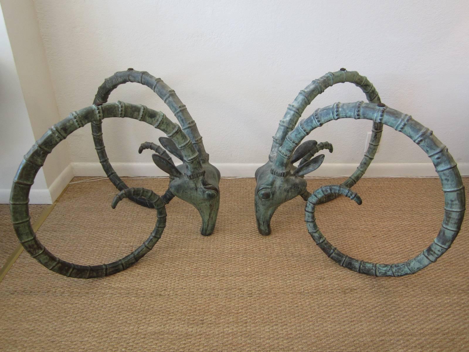Wonderful pair of bronze ibex head table bases made for dining table or desk. Beautifully and naturally patinated, these bases are exquisite as they are yet they have the option to be polished to a shiny bronze/brass finish. They are perfectly ready