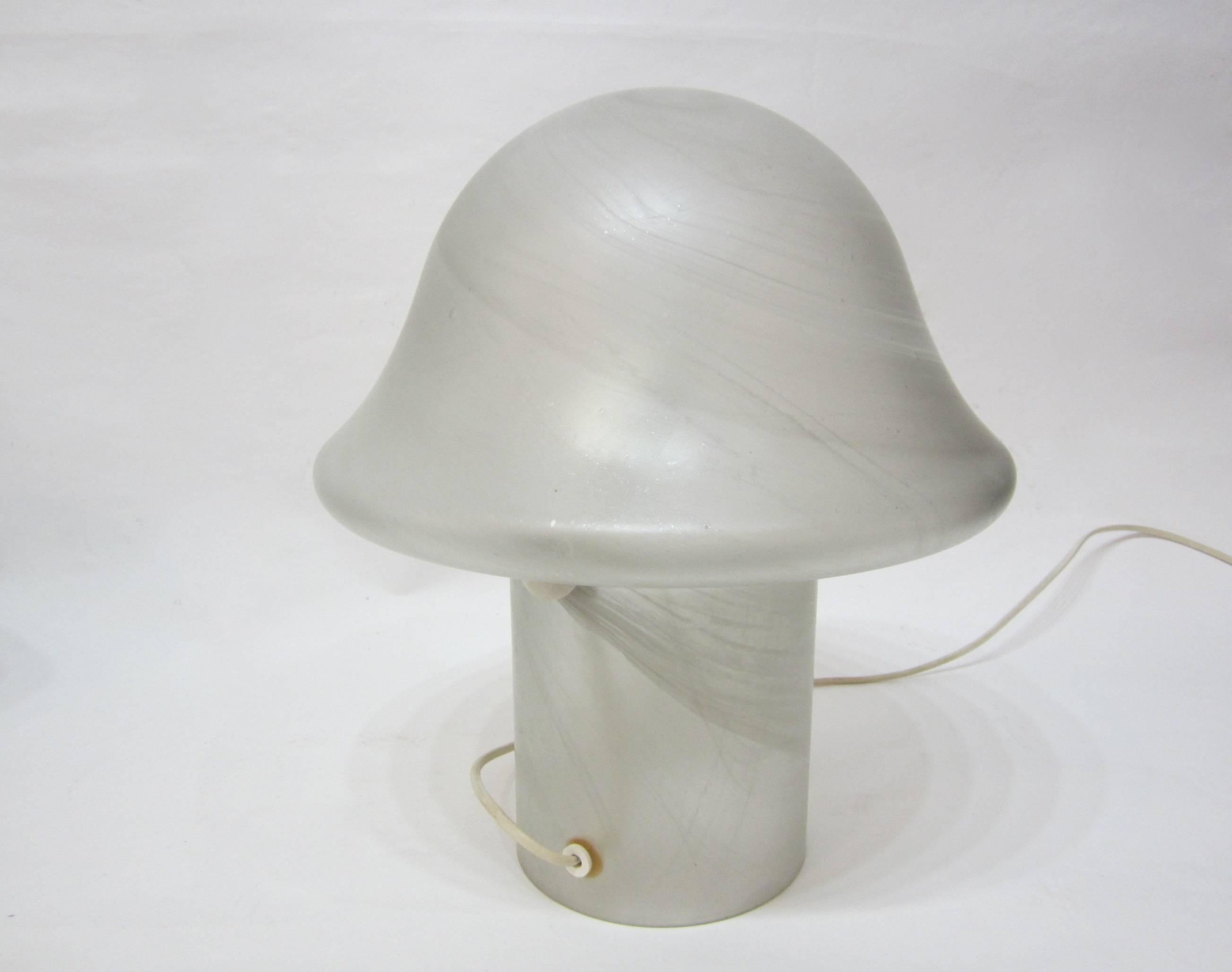 Beautifully executed lamp in one solid piece of frosted glass with pearlized swirl pattern resembling fiberglass. Original wiring and on-off switch and European plug. Signed.