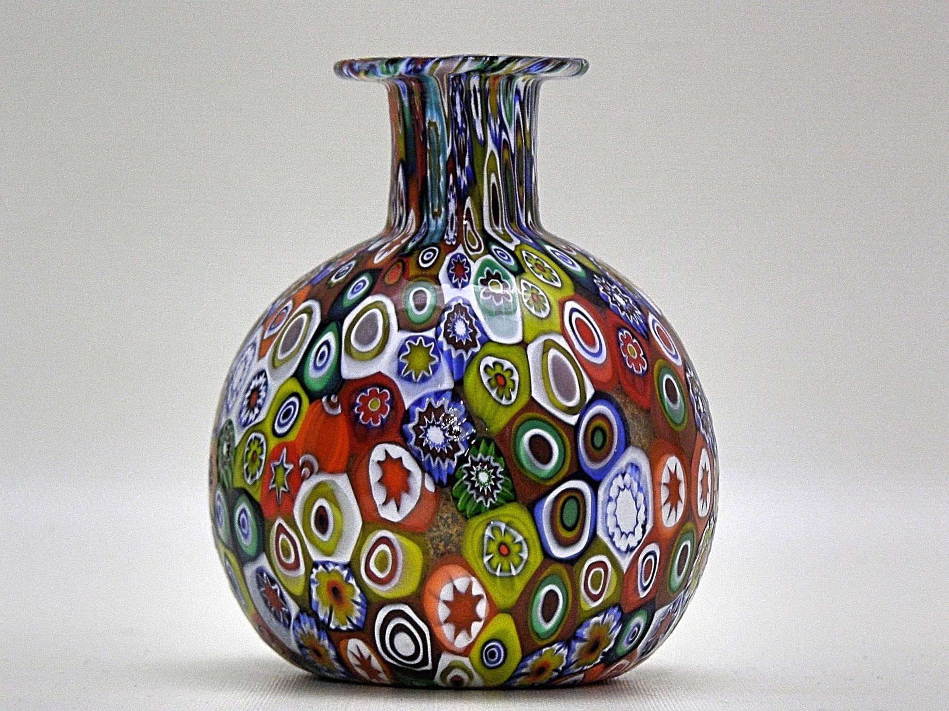 Gorgeous handblown Murano glass small bud vase with raised millefiori design. Great as utilitarian vase and by itself as display. Beautiful texture and pattern.