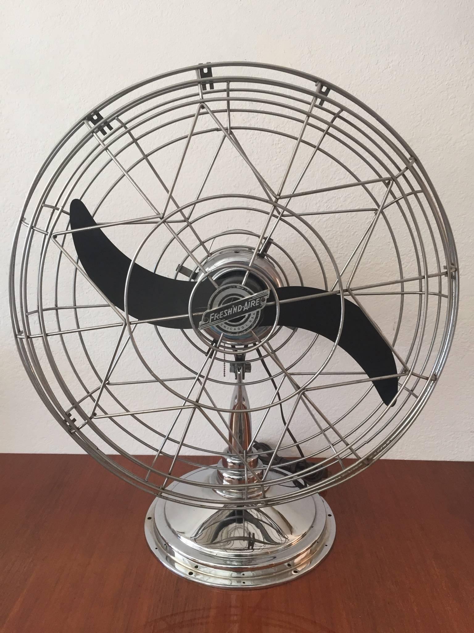 Vintage 1947 three-speed pull-chain chrome fan by General Electric named Fresh'nd Aire. Model no. 20 with 20 inch bakelite blade and chrome cage, motor cover and base.
Excellent restored condition.
Stats: No. 20-5994.
60 cycles.
130 watts.
115