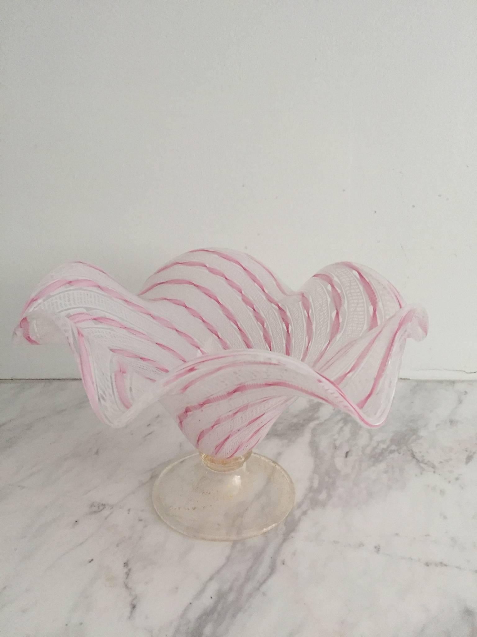 Beautiful Seguso handblown Murano glass scalloped-edge Latticino pedestal bowl in pink and white with a lot of gold flecking.